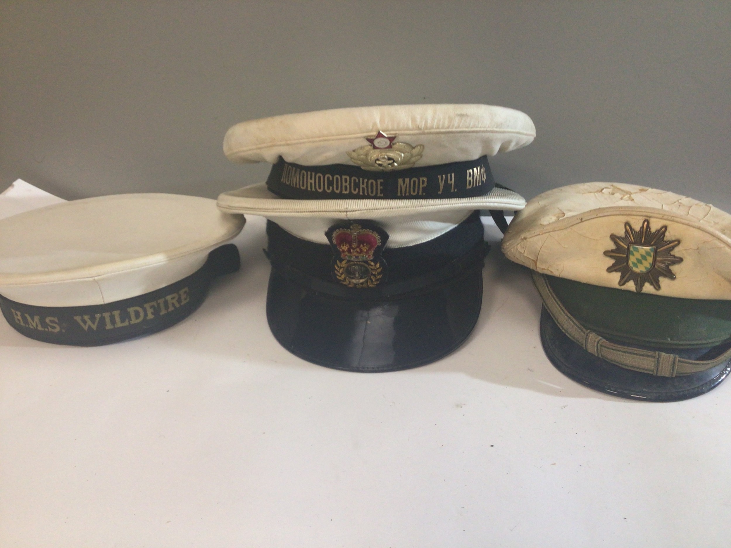 A collection of cloth Caps. HMS Wildfire RAF German Police Russian Navy (5)