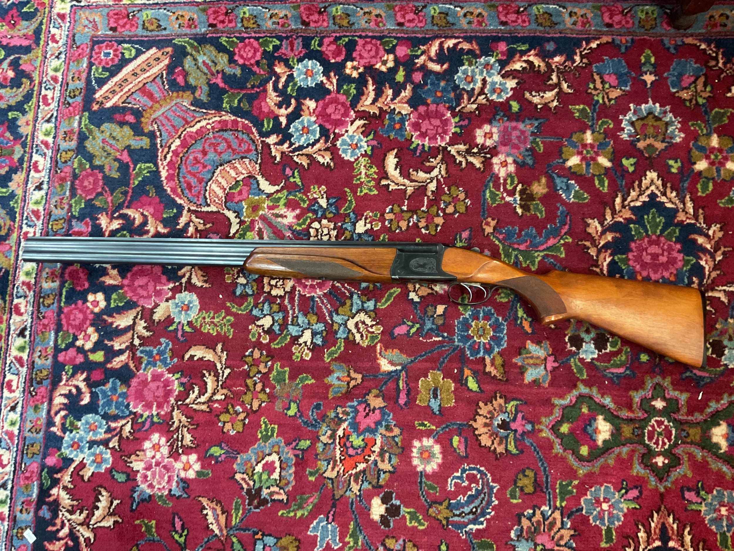 SHOTGUN LICENSE REQUIRED ON THIS LOT AS WELL AS ARRANGING APPOINTMENT TO VIEW AND COLLECT THANK YOU.  NO RESERVE A12 gauge Baikal over and under shotgun, 27.5 cm barrels, Ser No H02133. With engravings to plates and a pair of snap caps.clean barrels.