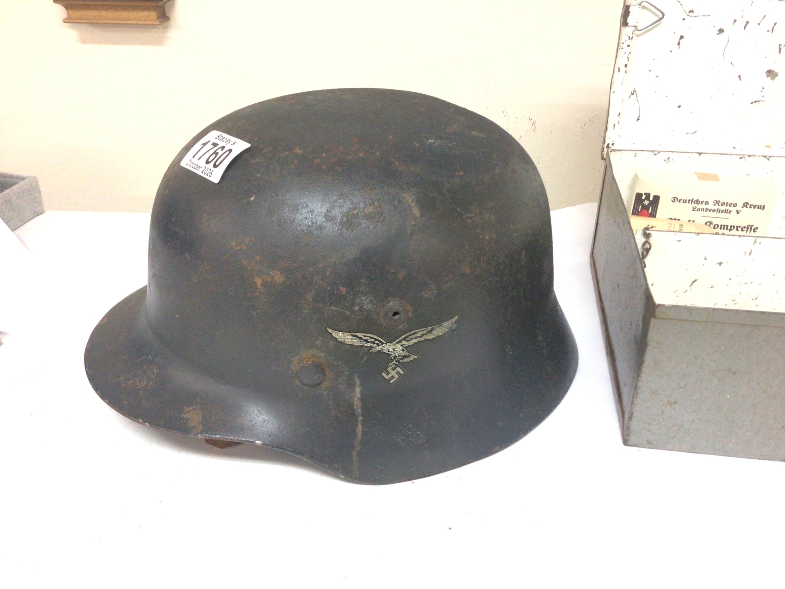  A German Third Reich Luftwaffe steel helmet later lining Possible M35 folded edge with internal stamp marks and Tin medical box (2) 