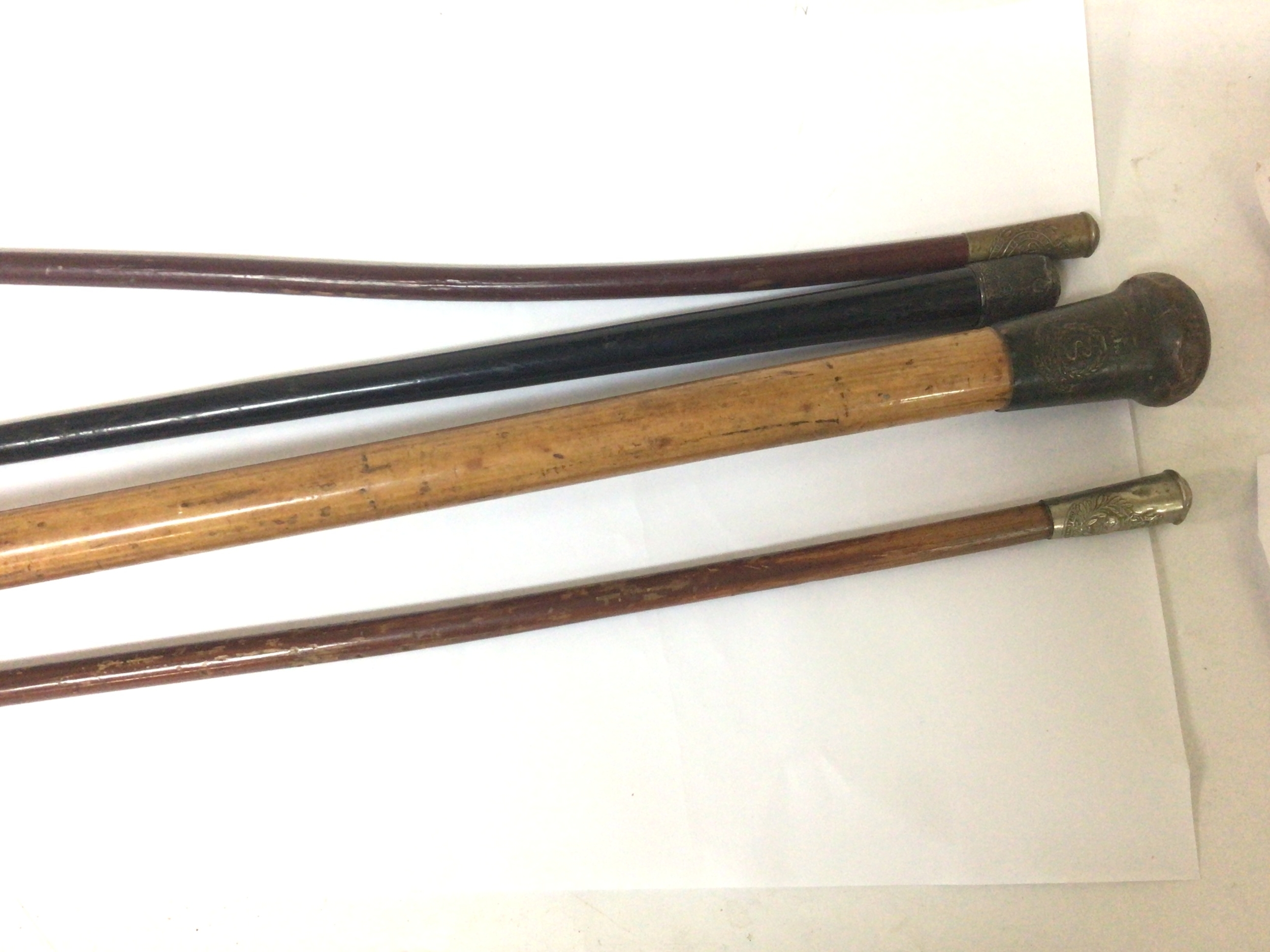  A Medical Corps officers stick other swagger sticks and a silver mounted stick (4) 
