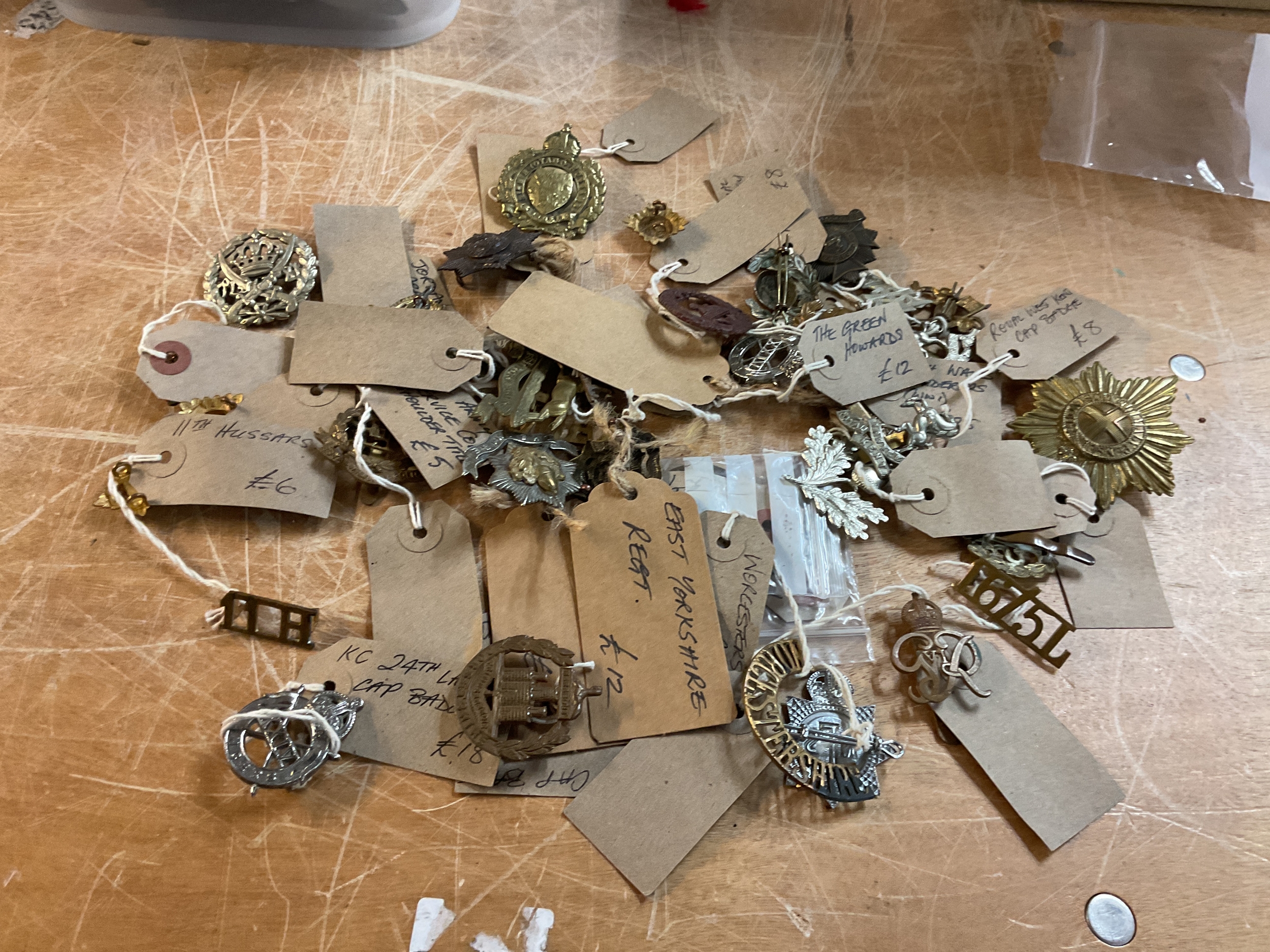 Large Qty of WWII cap badges.