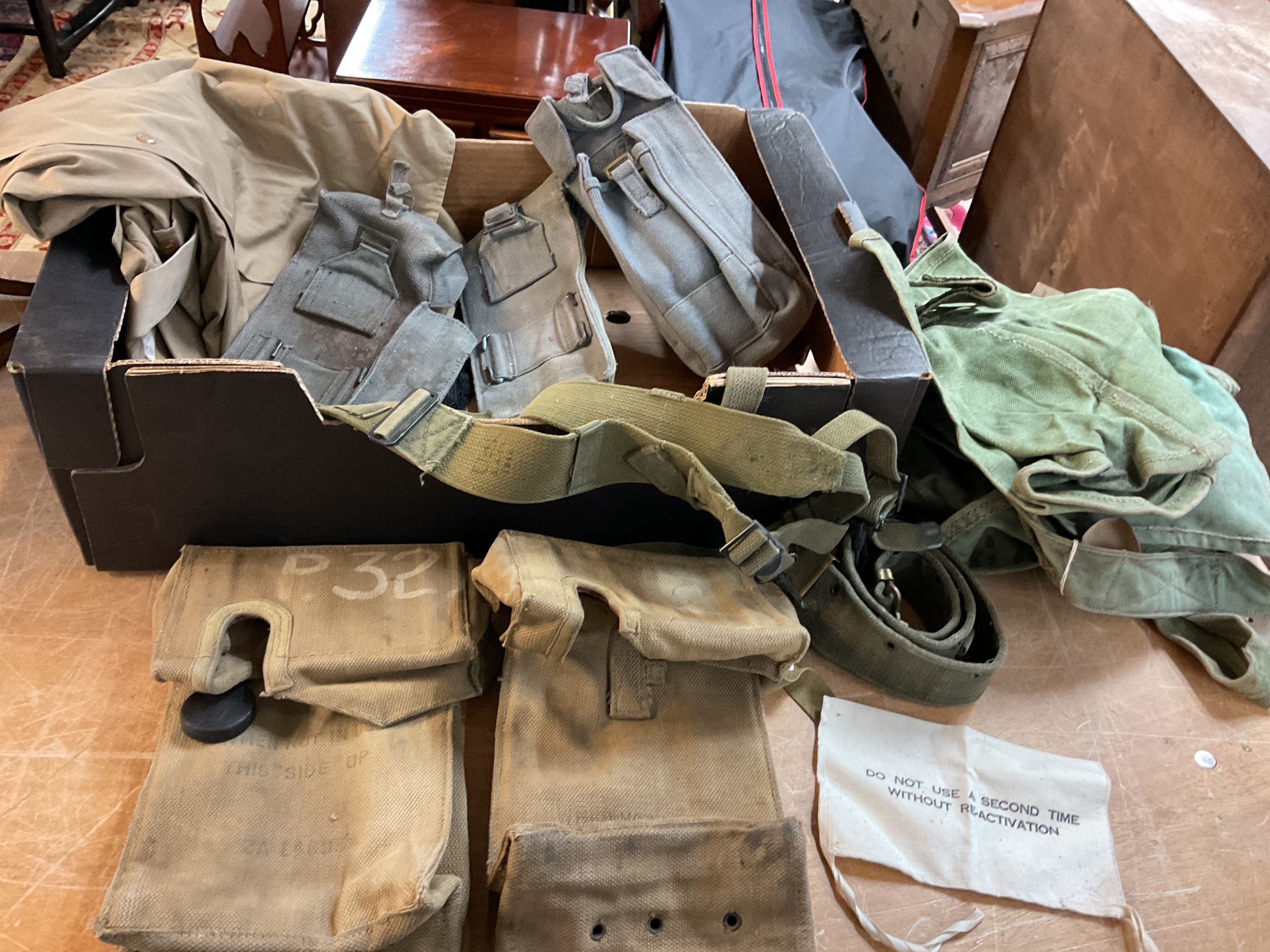 Qty WWII Era webbing items to inc buckets, radio equipment, pouches, US yokes, and belt.