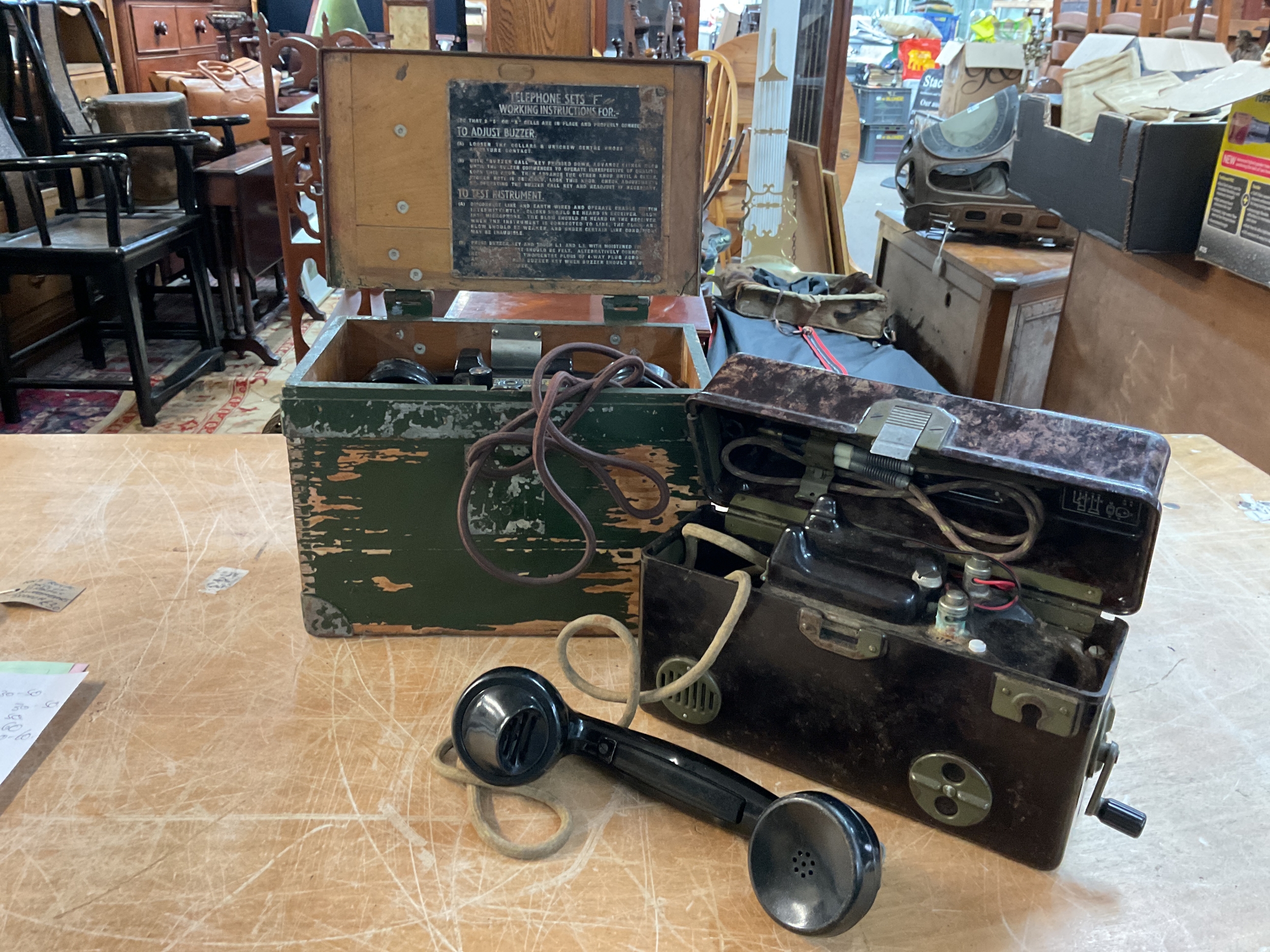 Two military field telephones.