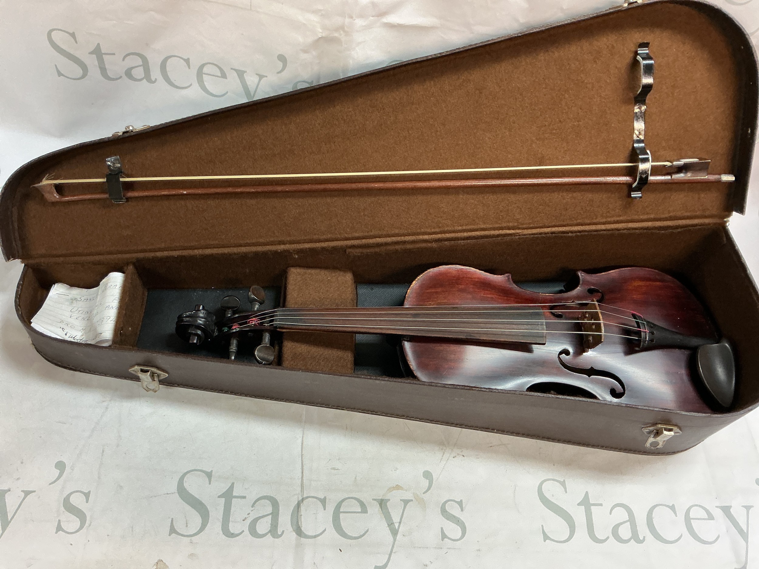 3 quarter size cased violin with sticker with bow. 38cm