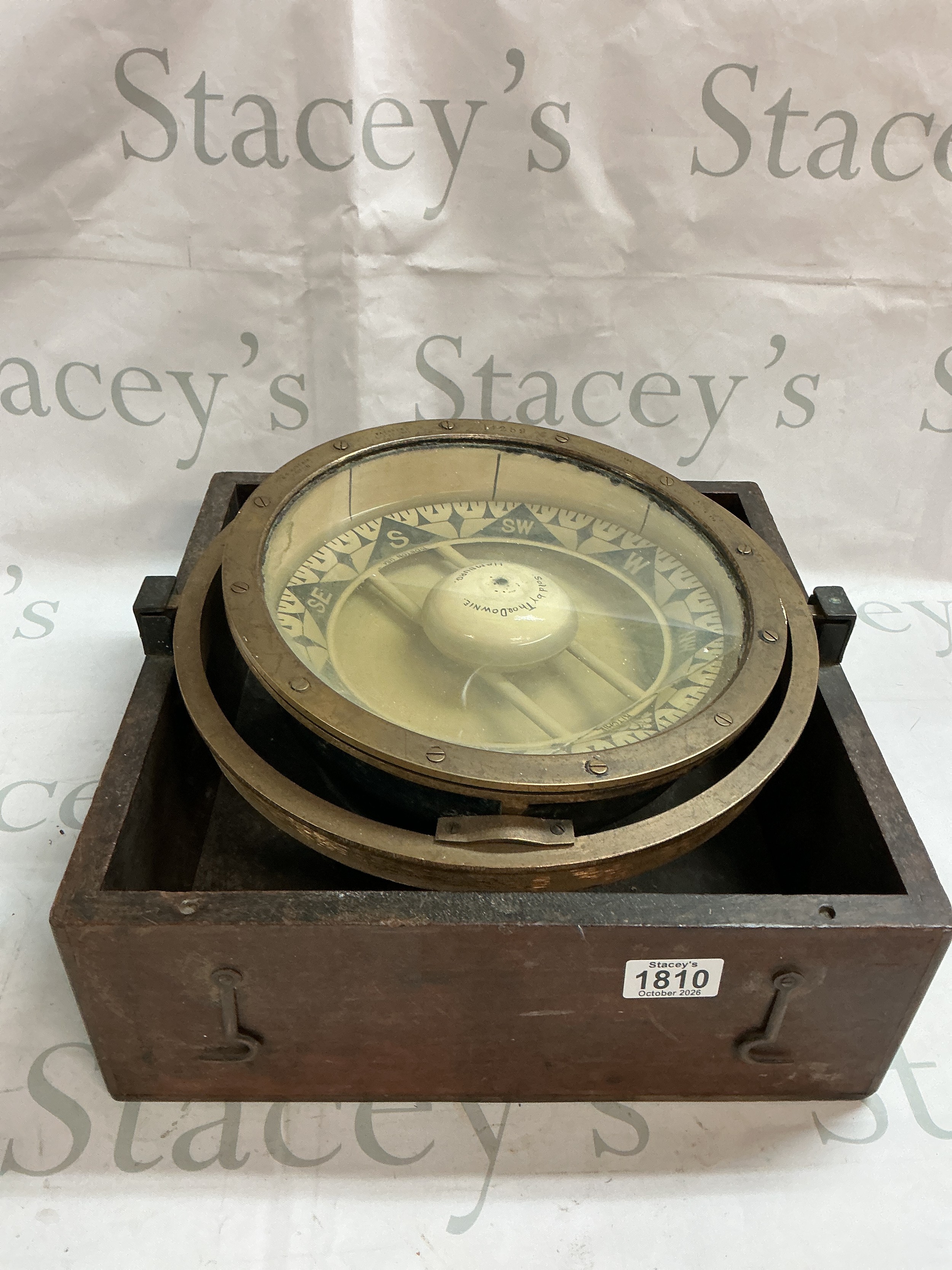 A Ships Compass in a brass gimbal.
