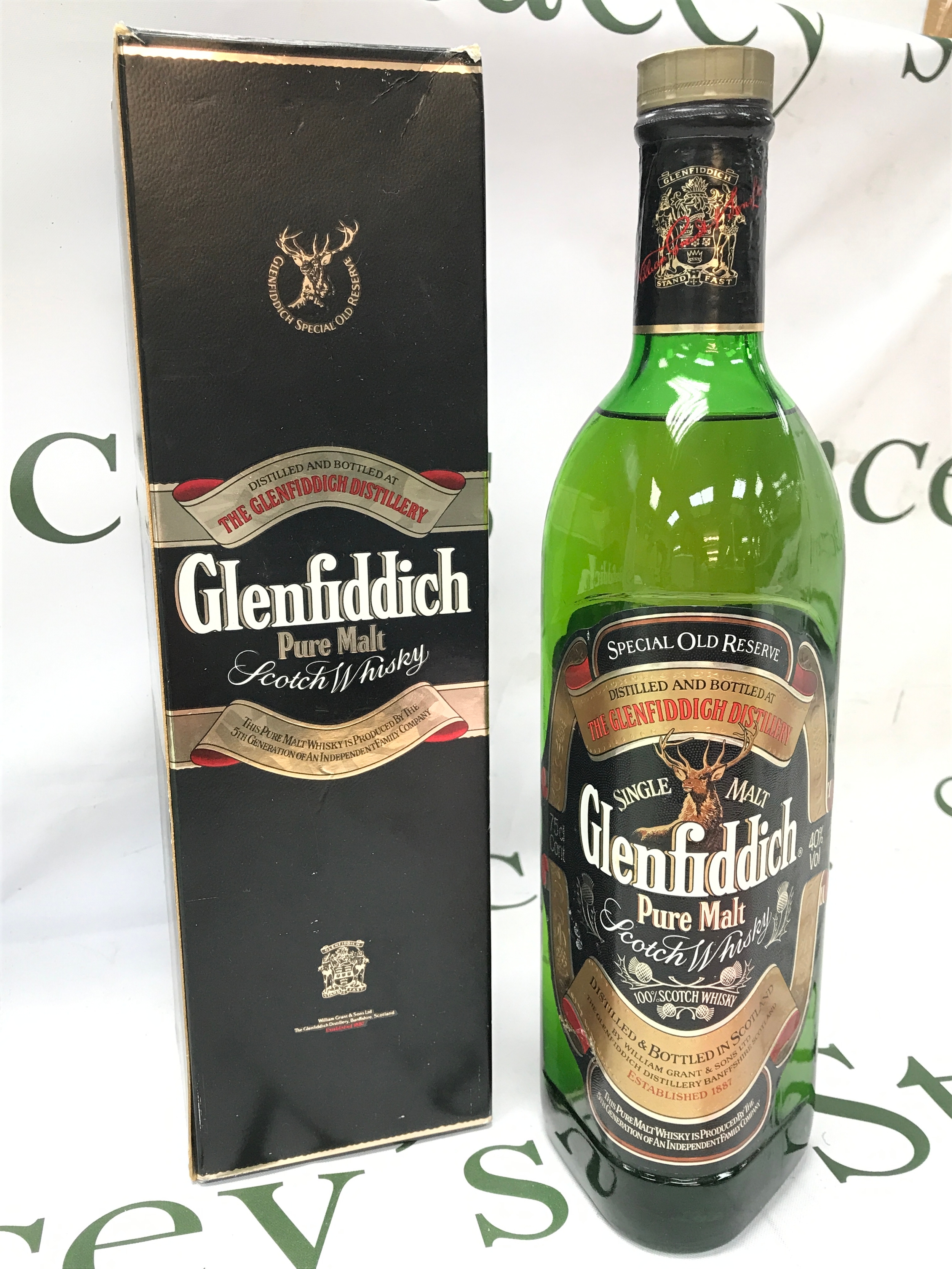 A boxed bottle of old Glenfiddich pure malt 