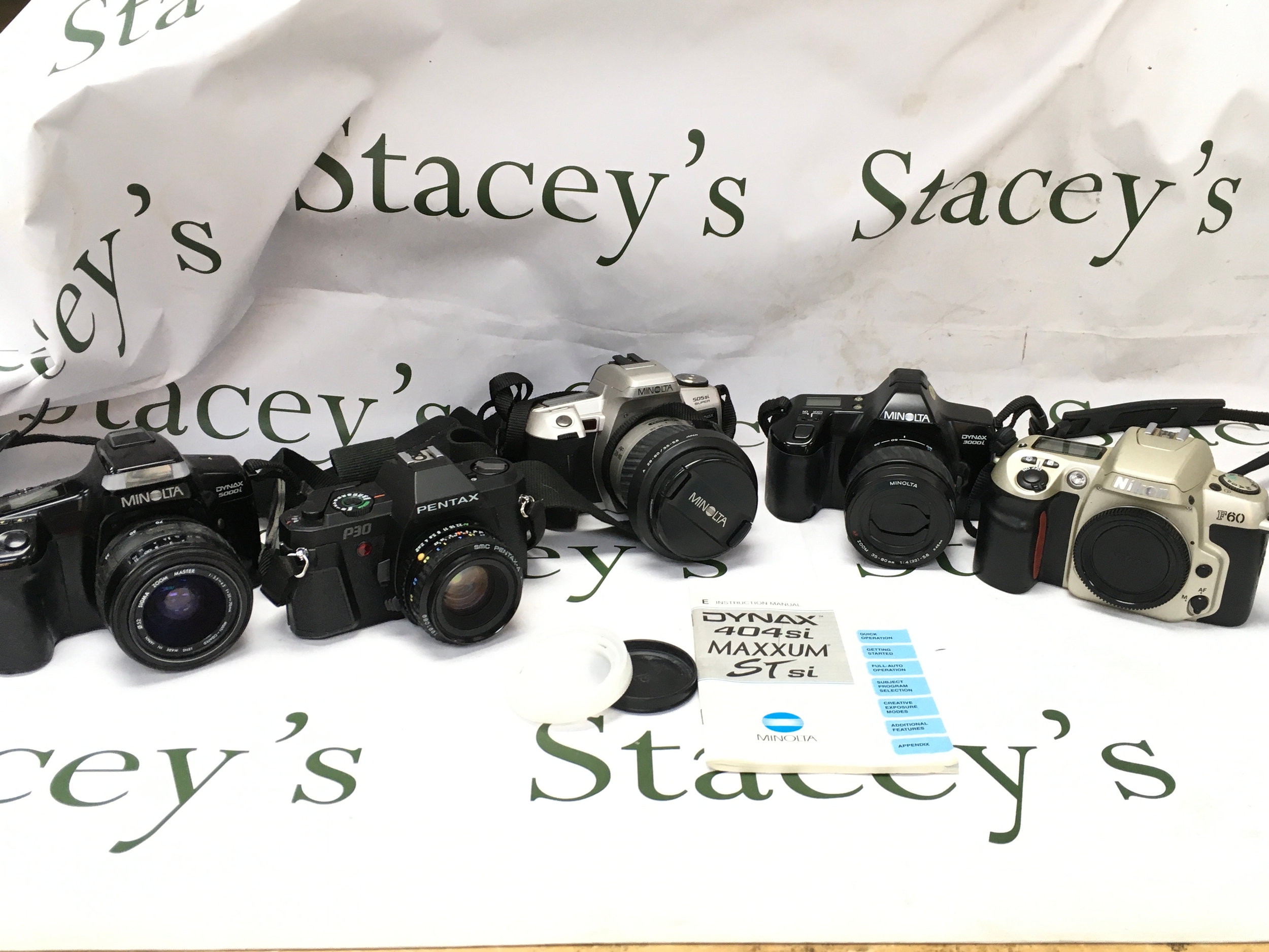 Five vintage SLR cameras, Canon, Minolta, Nikon etc 