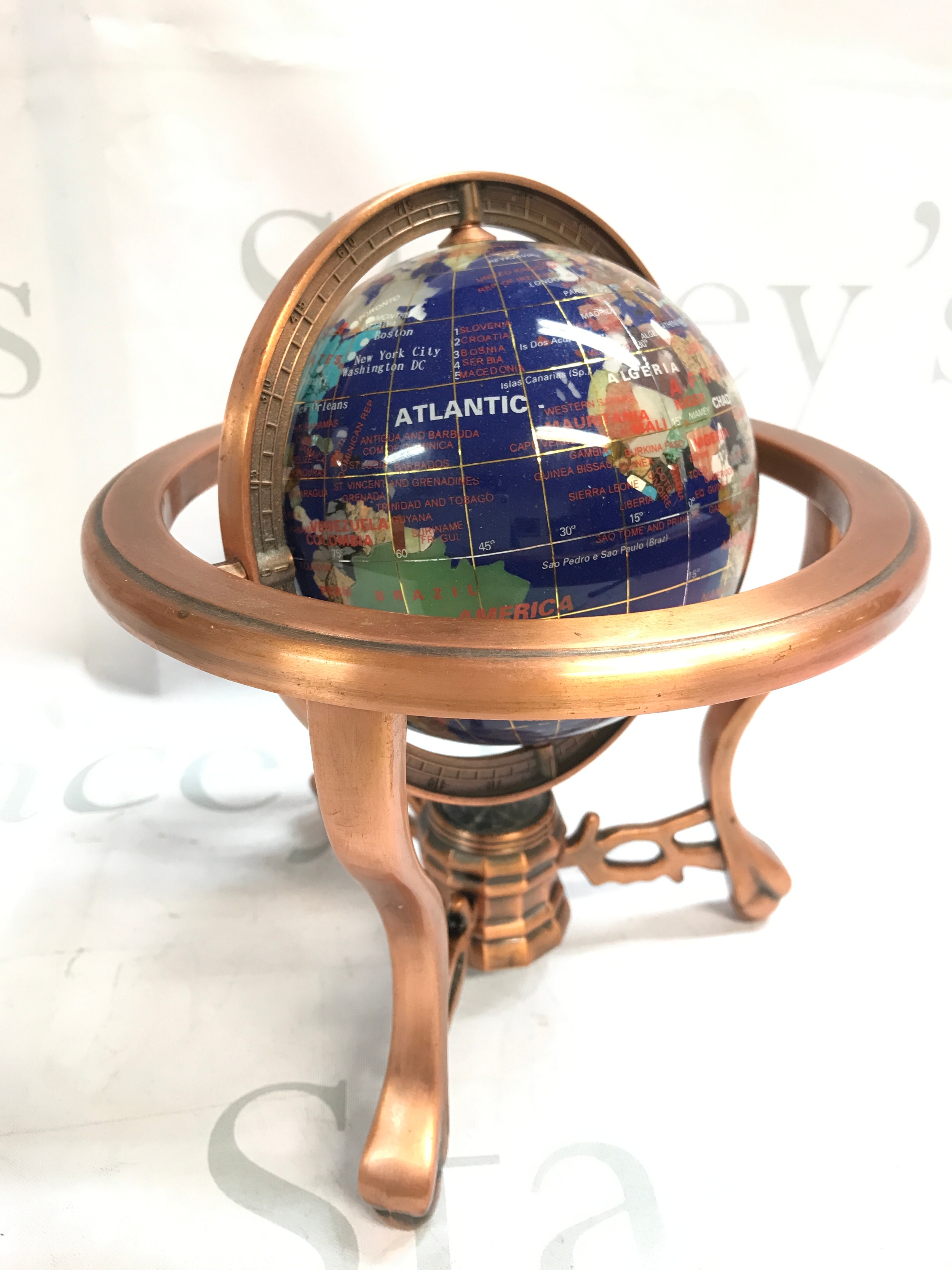 A gem stone globe , 22cm tall