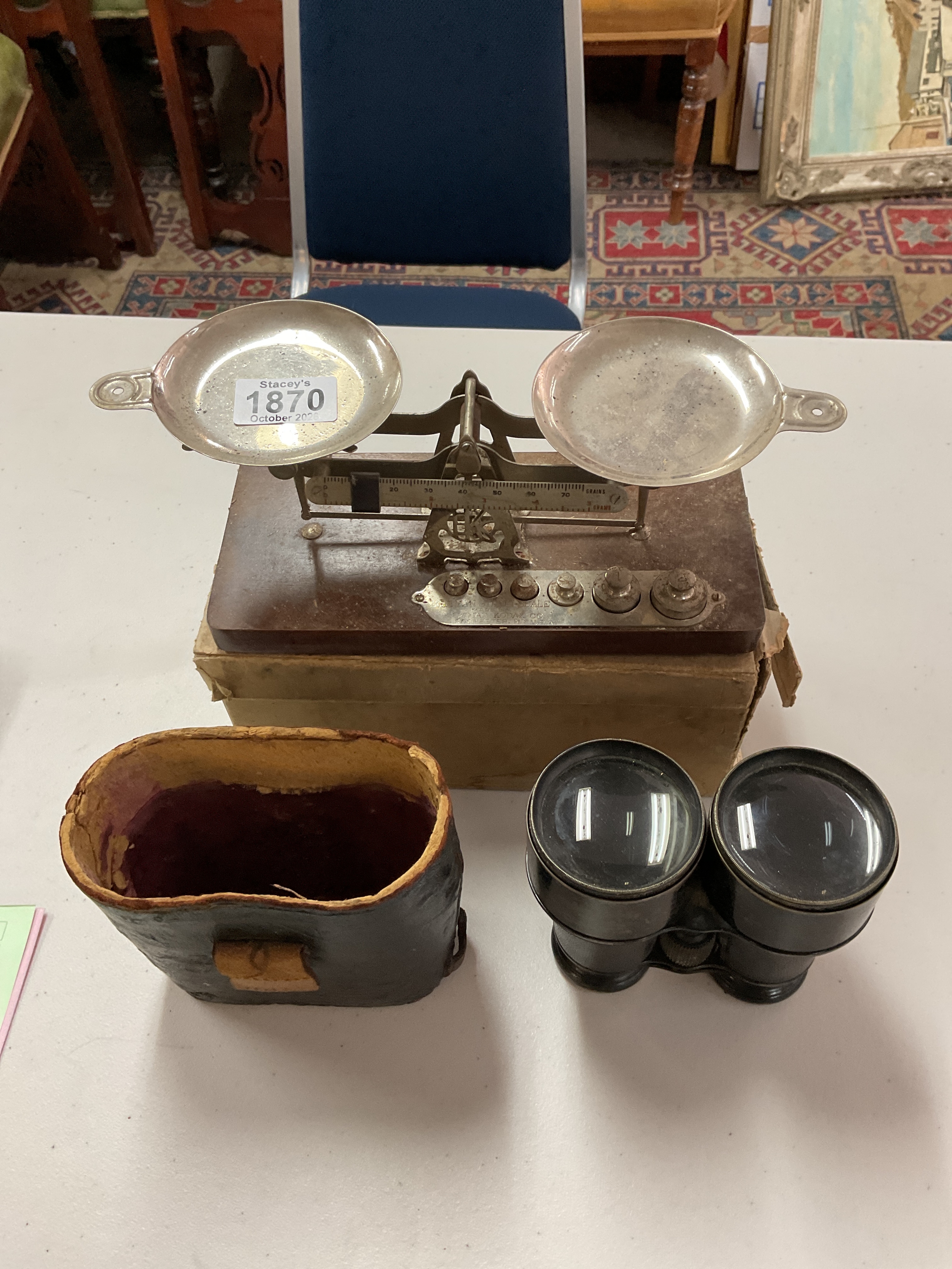 Pair of boxed vintage scales by Eastman Kodak, and a pair of WWI navy binoculars by Sewill of Glasgow.