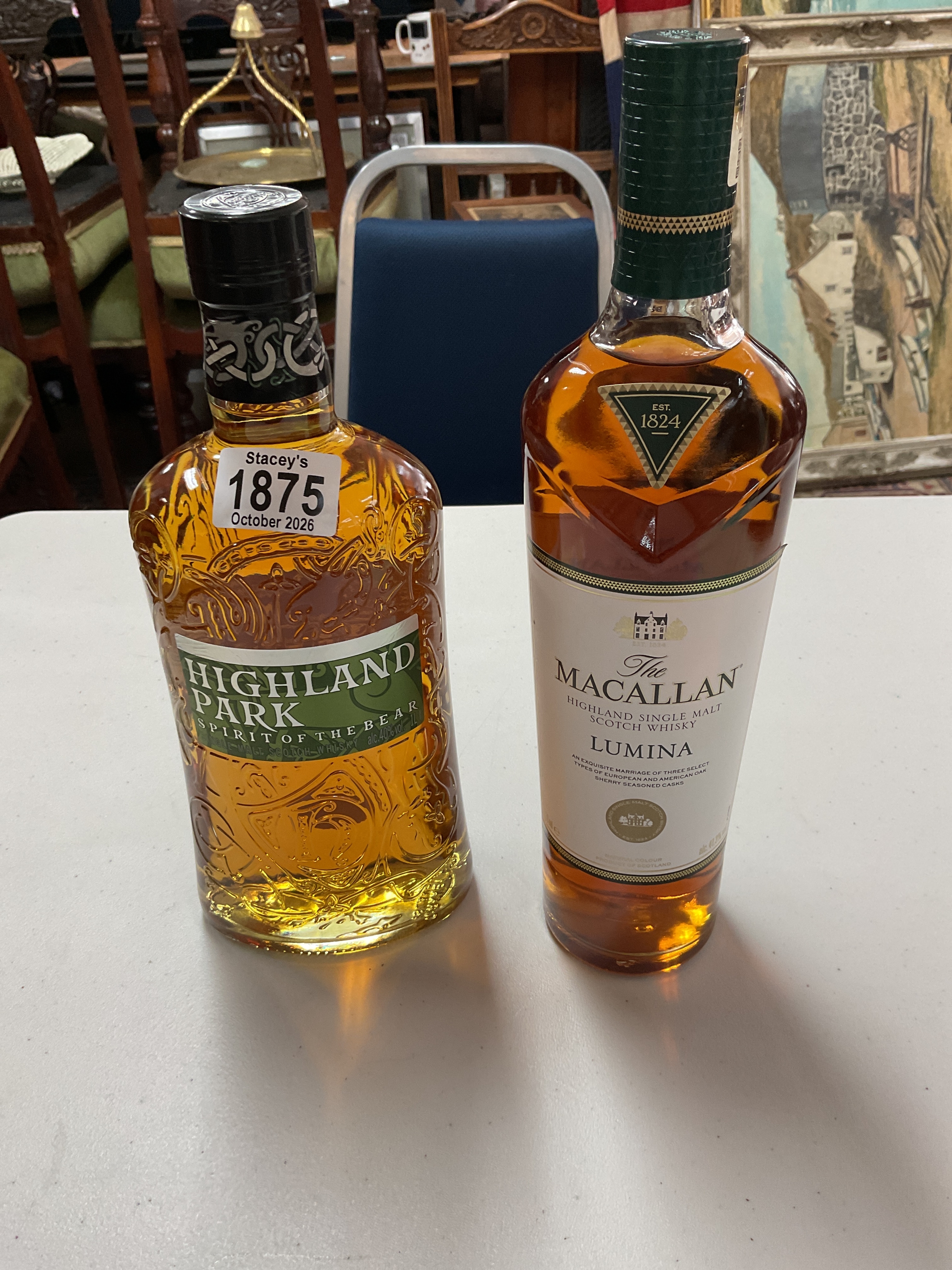 Bottle of The Macallan Lumina and bottle of Highland Park Spirit of the Bear malt whisky.