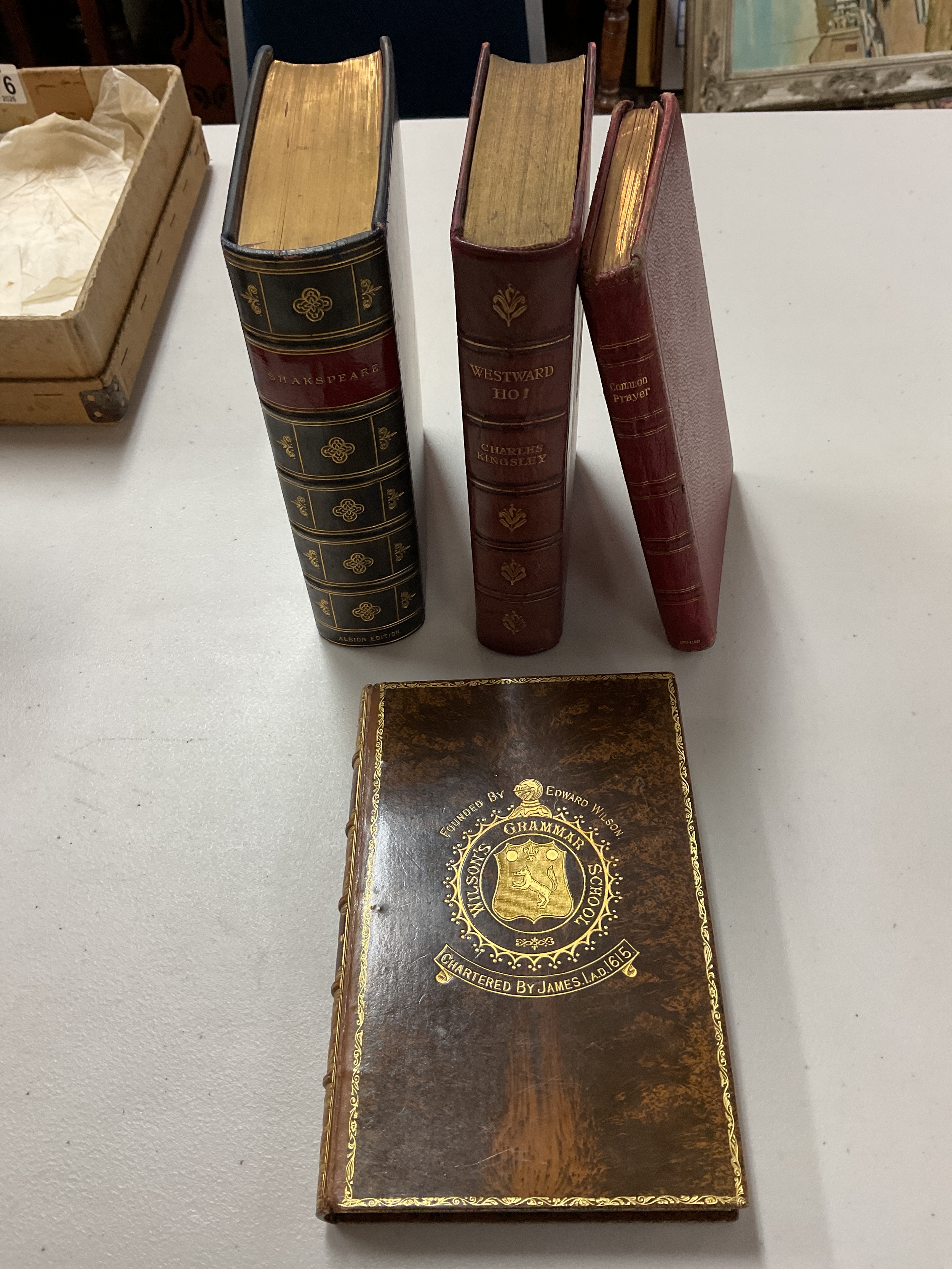 Four Victorian books Cardinal Wolsey 1912 Ed in high grade binding, common prayer, Westward Ho and Albion Edition Shakespeare in high grade binding.