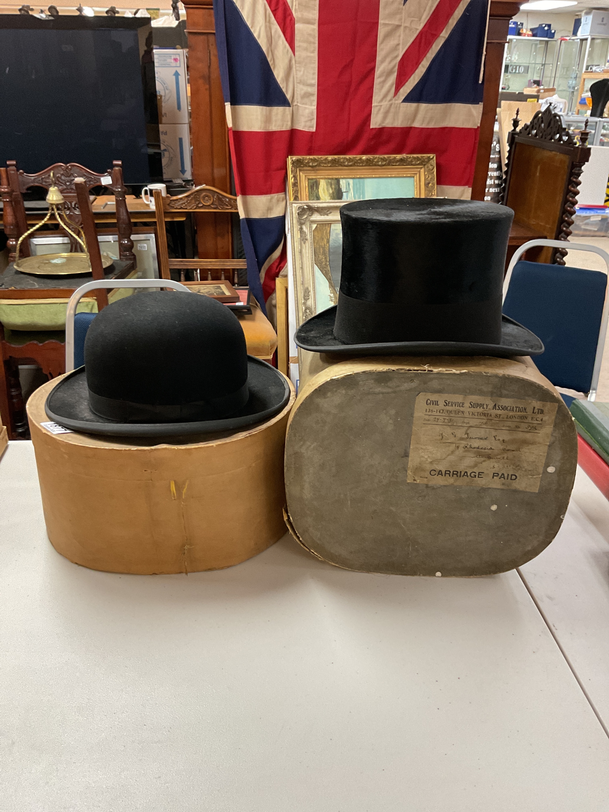 Cased bowler and top hat good condition.