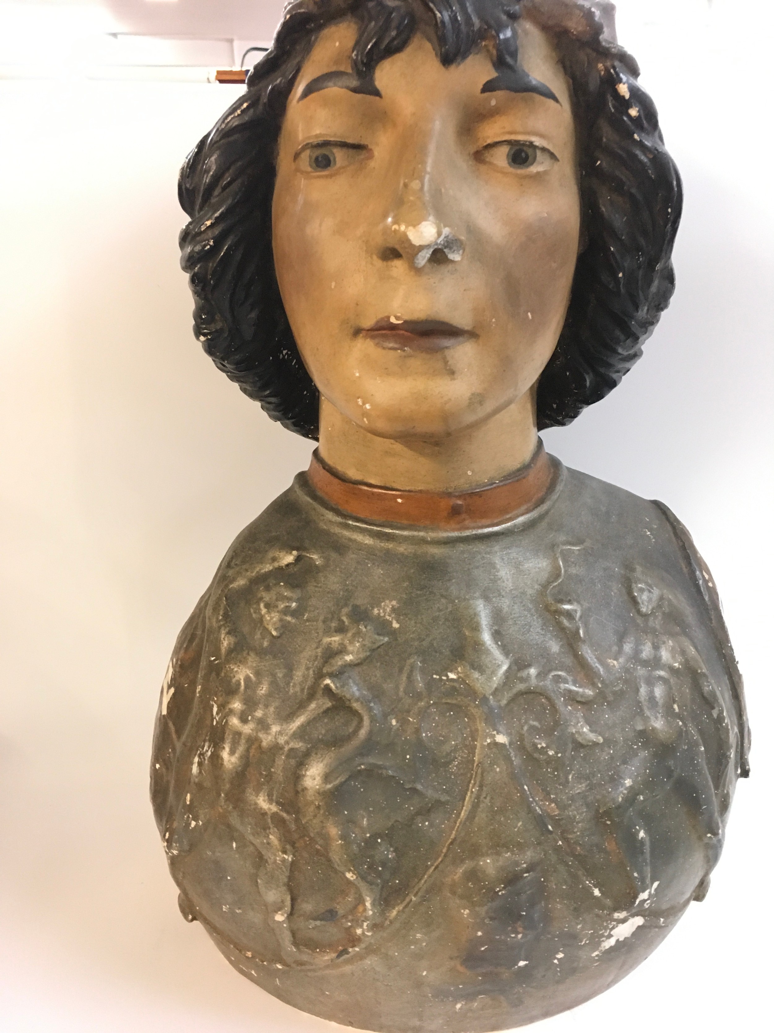  A large plaster bust later painted 19th century. 50cm tall
 