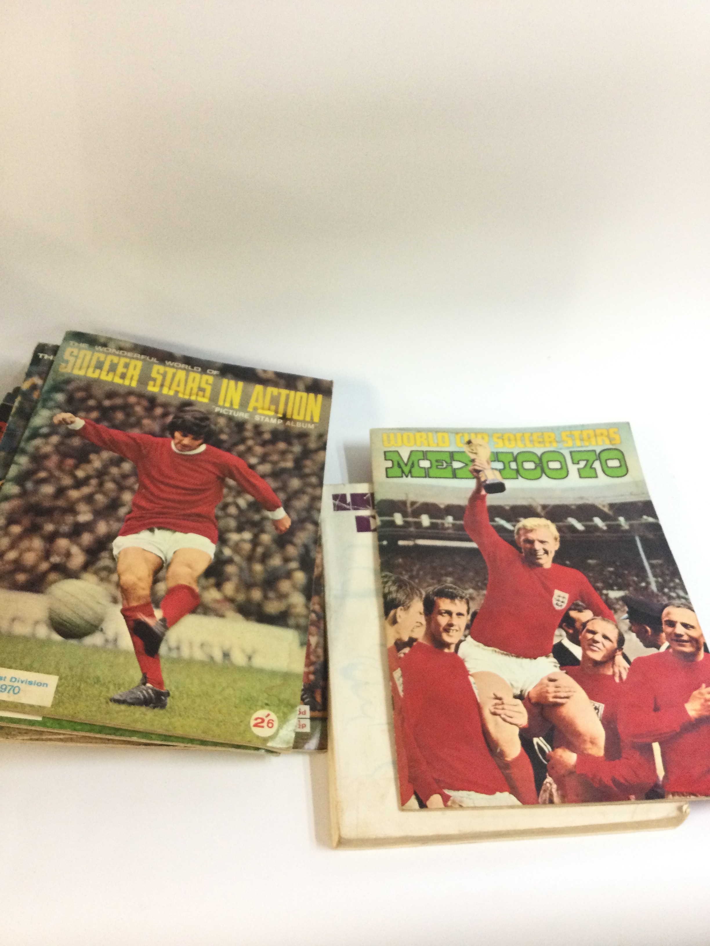 Collection of football programmes and other books and leaflets including a World Cup soccer stars Mexico 70 sticker book (half full)