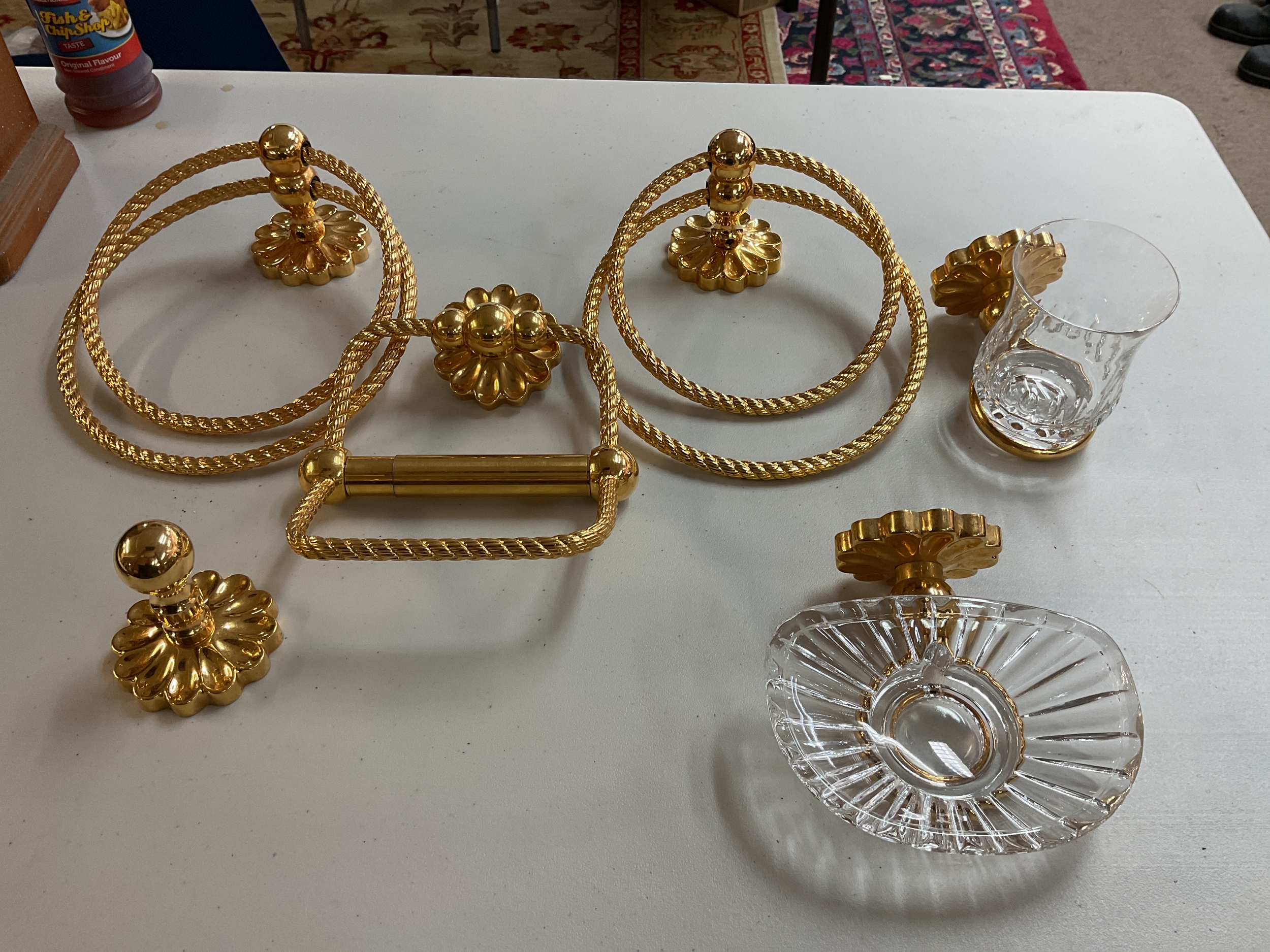 Gilded ornate bathroom set.
