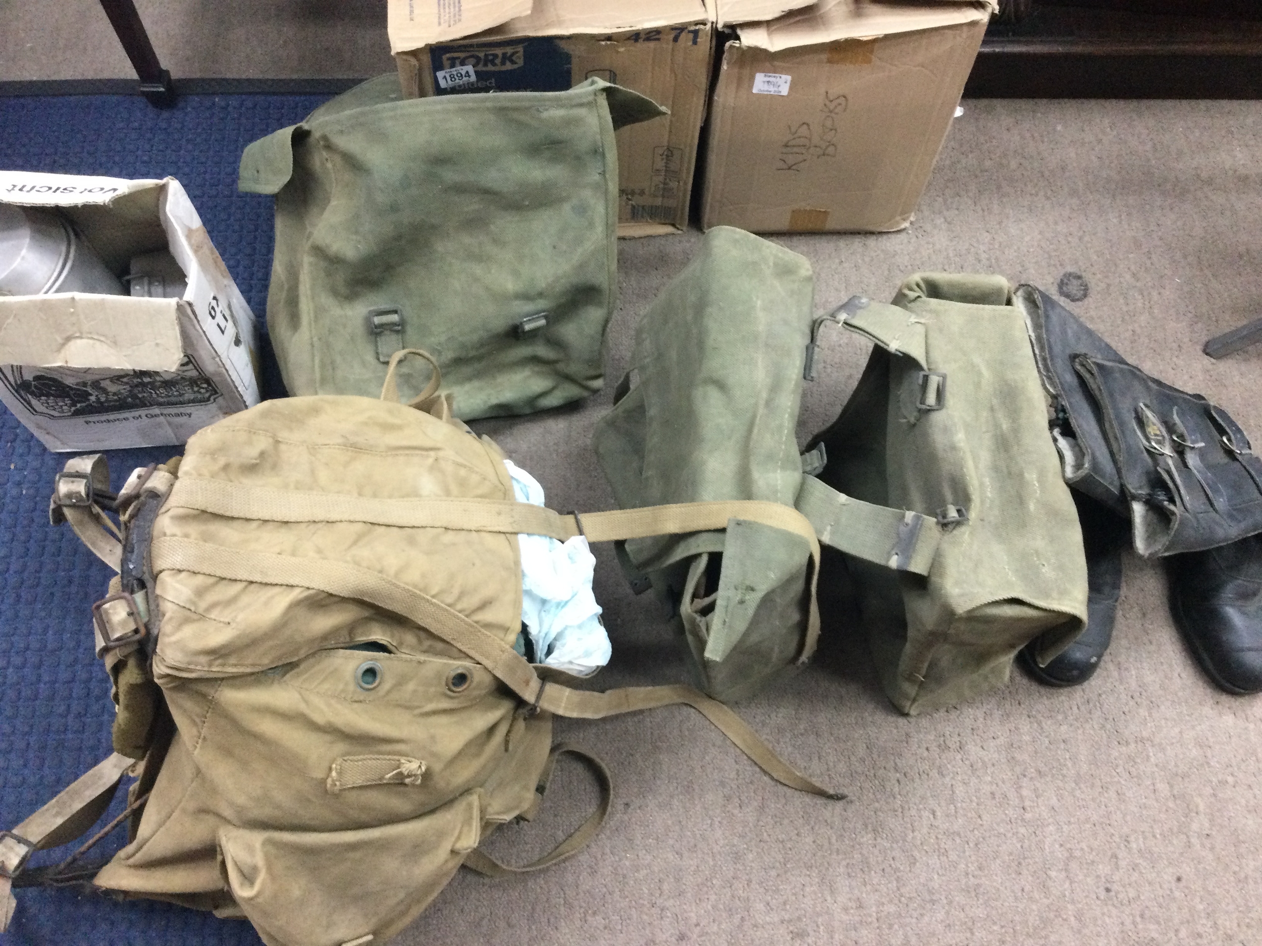 Collection of military gear and biker boots and and panniers