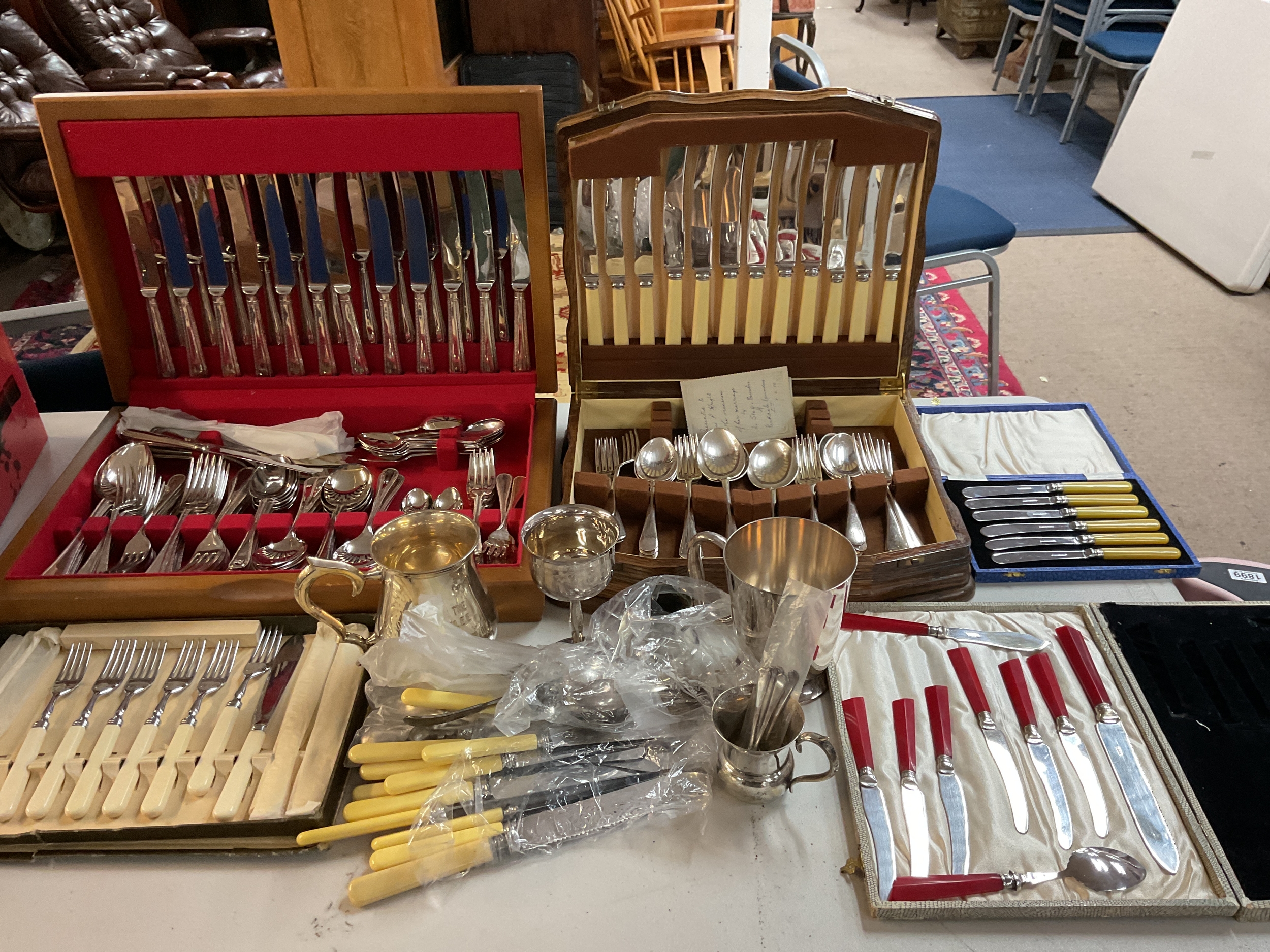 Qty silver plated items and two canteens of cutlery.