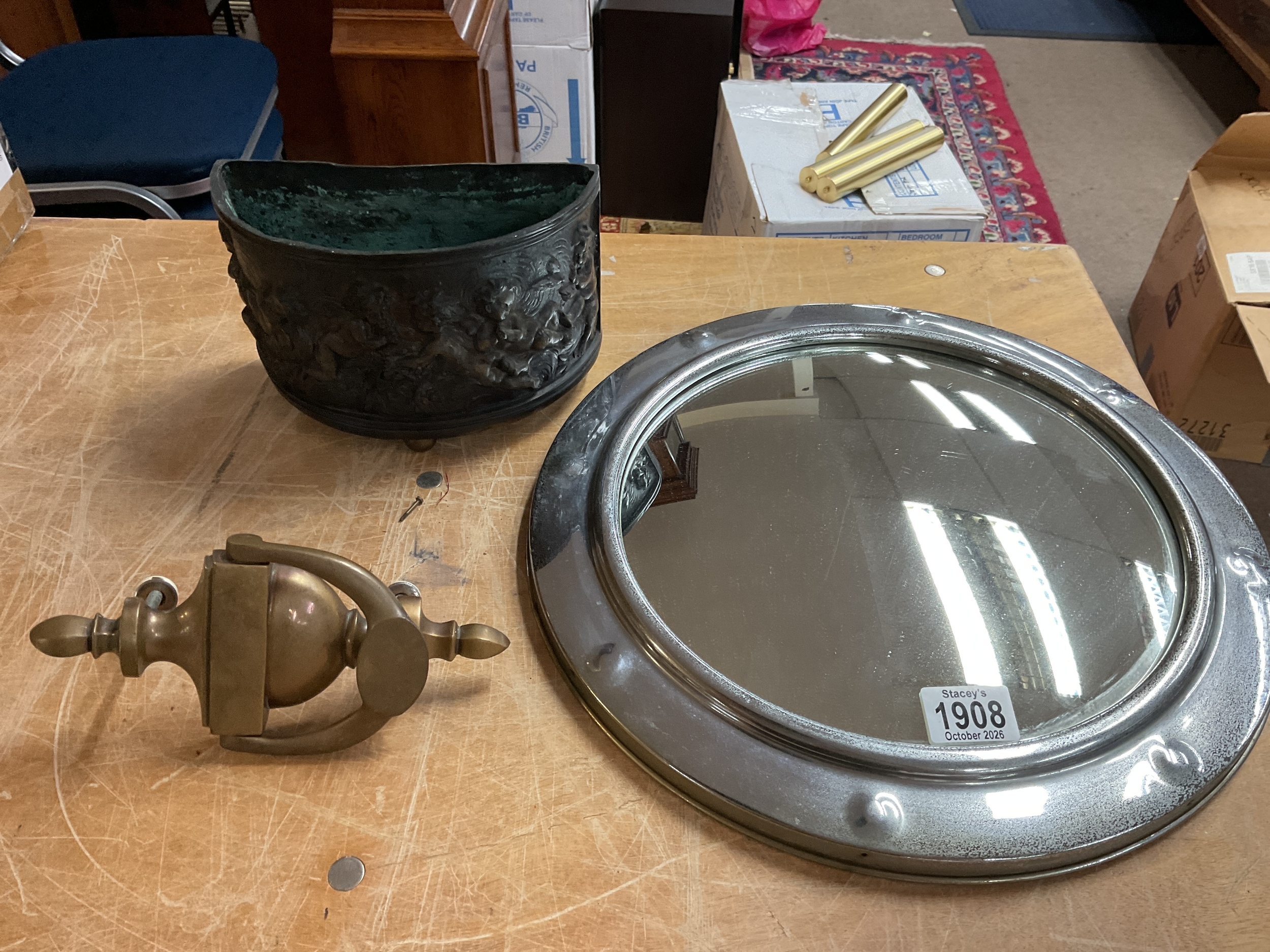 Bronze cherub planter, brass door knocker and chrome mirror.