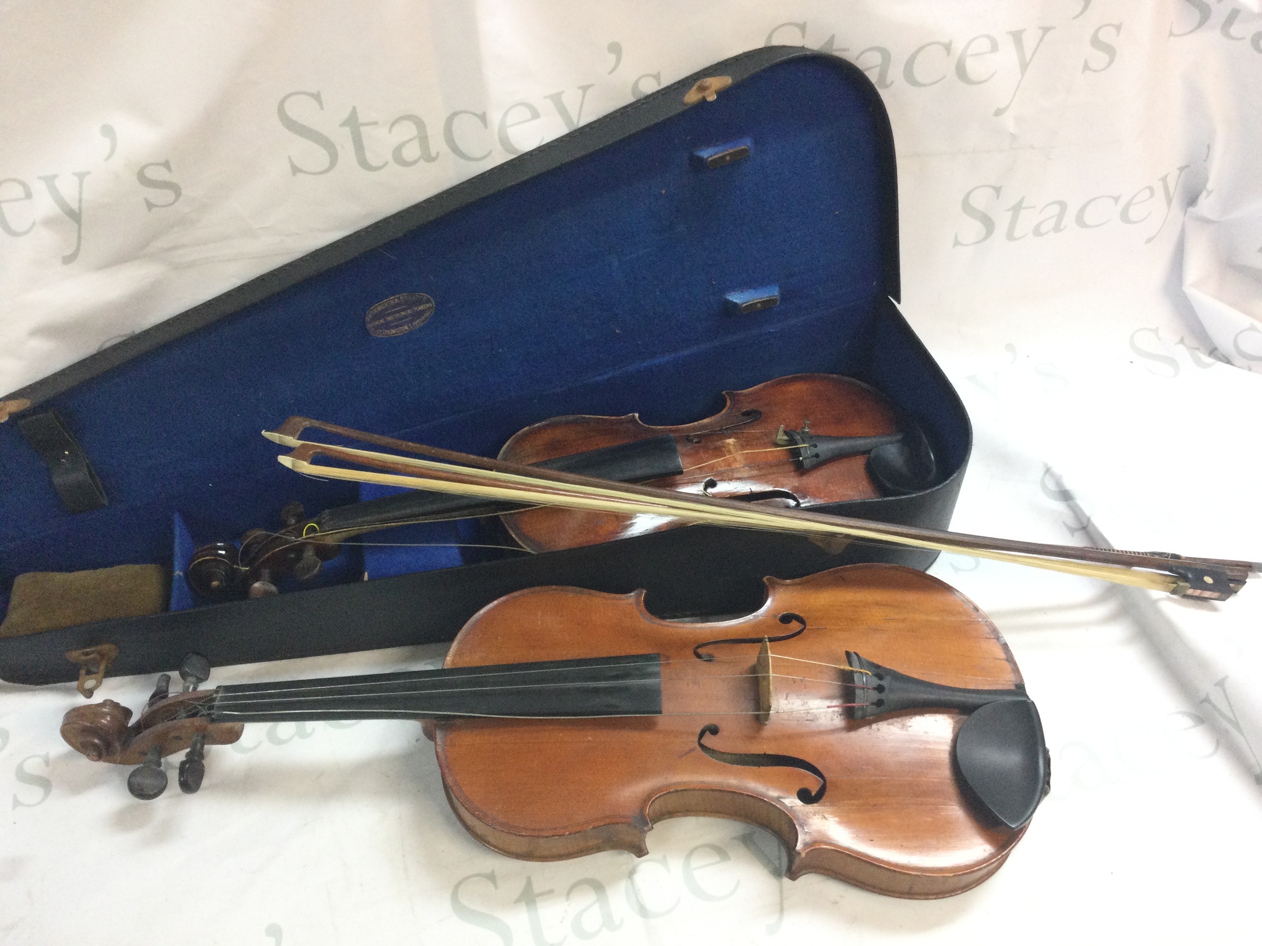 viola/ violin with two bows , cased violin. Label reads The Professor Violin 1913 Hawkes & Son Benman St Piccadilly Circus London