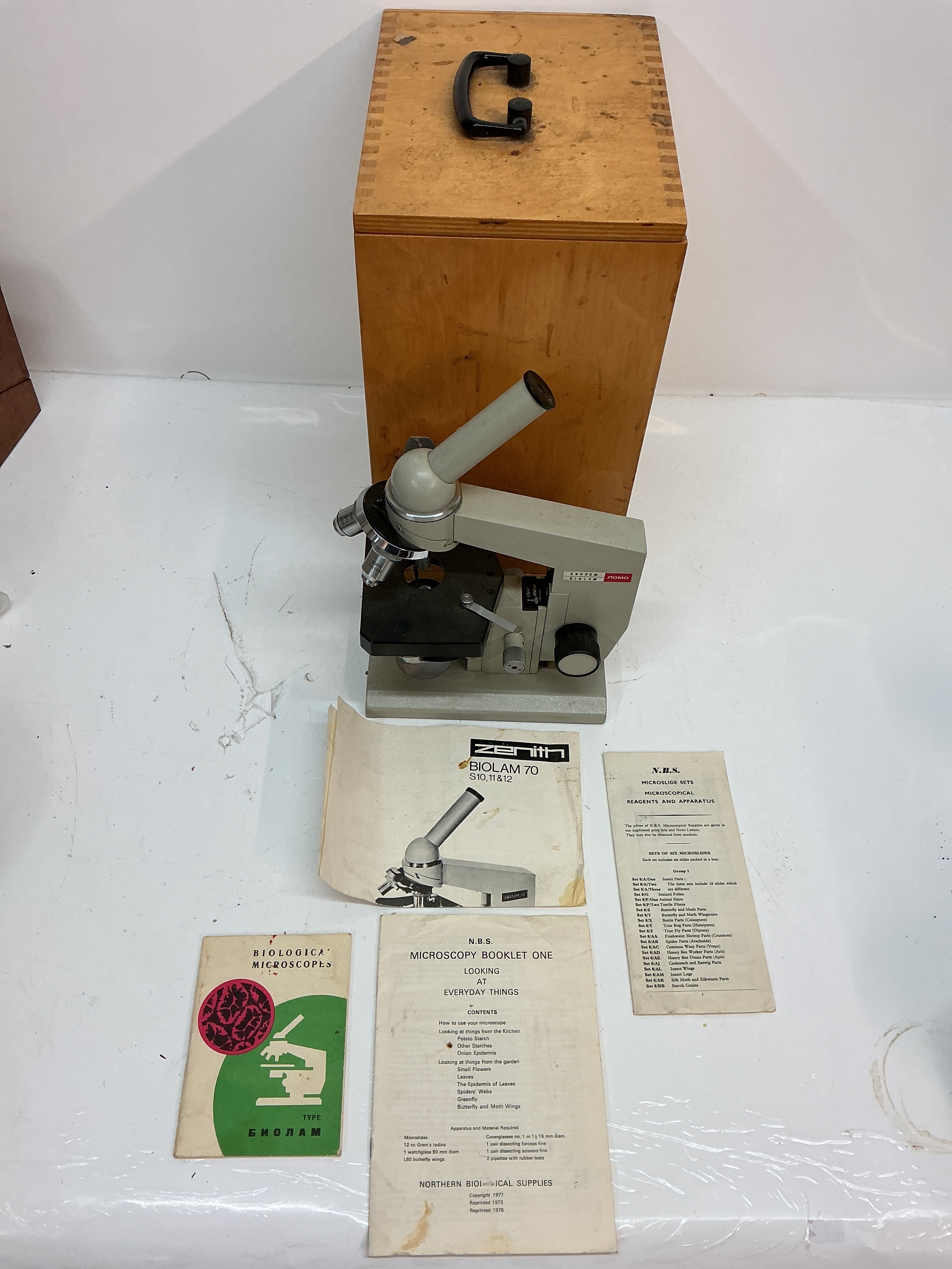 A boxed Nomo Biolam microscope  
