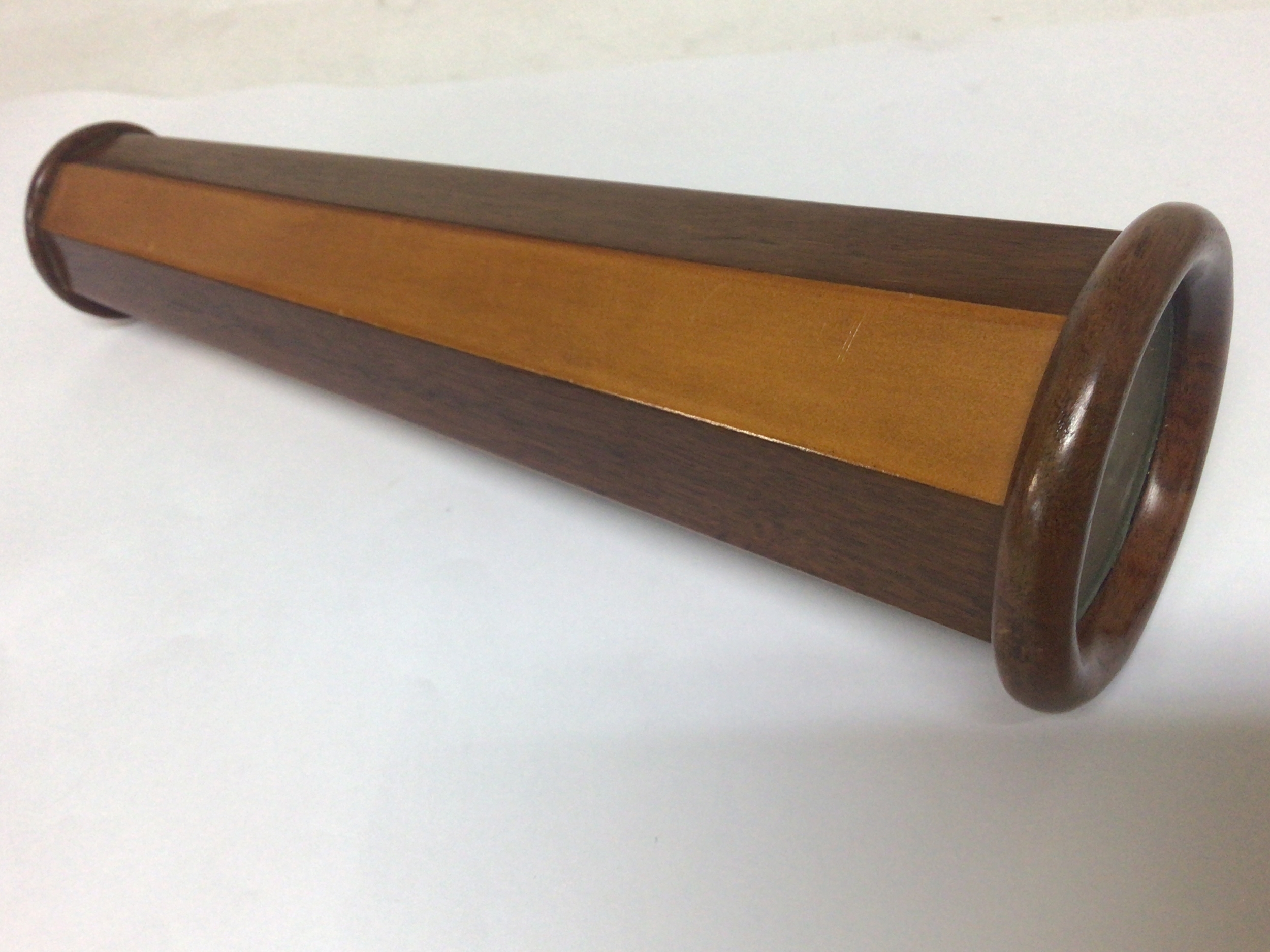  An early wood cased kaleidoscope with alternating box wood and satinwood sides.good condition.24cm long. working order no damage 
 