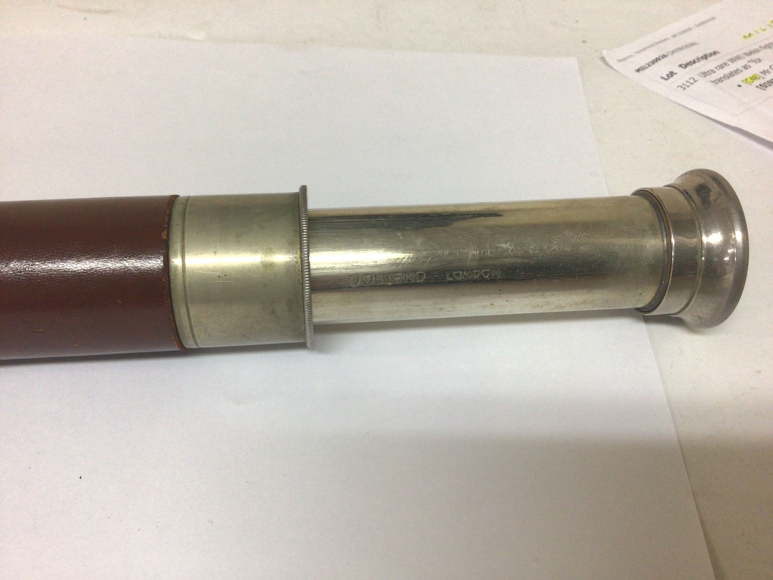  A leather cased chrome and polished steel telescope maker Dolland London. and a pair of binoculars. 