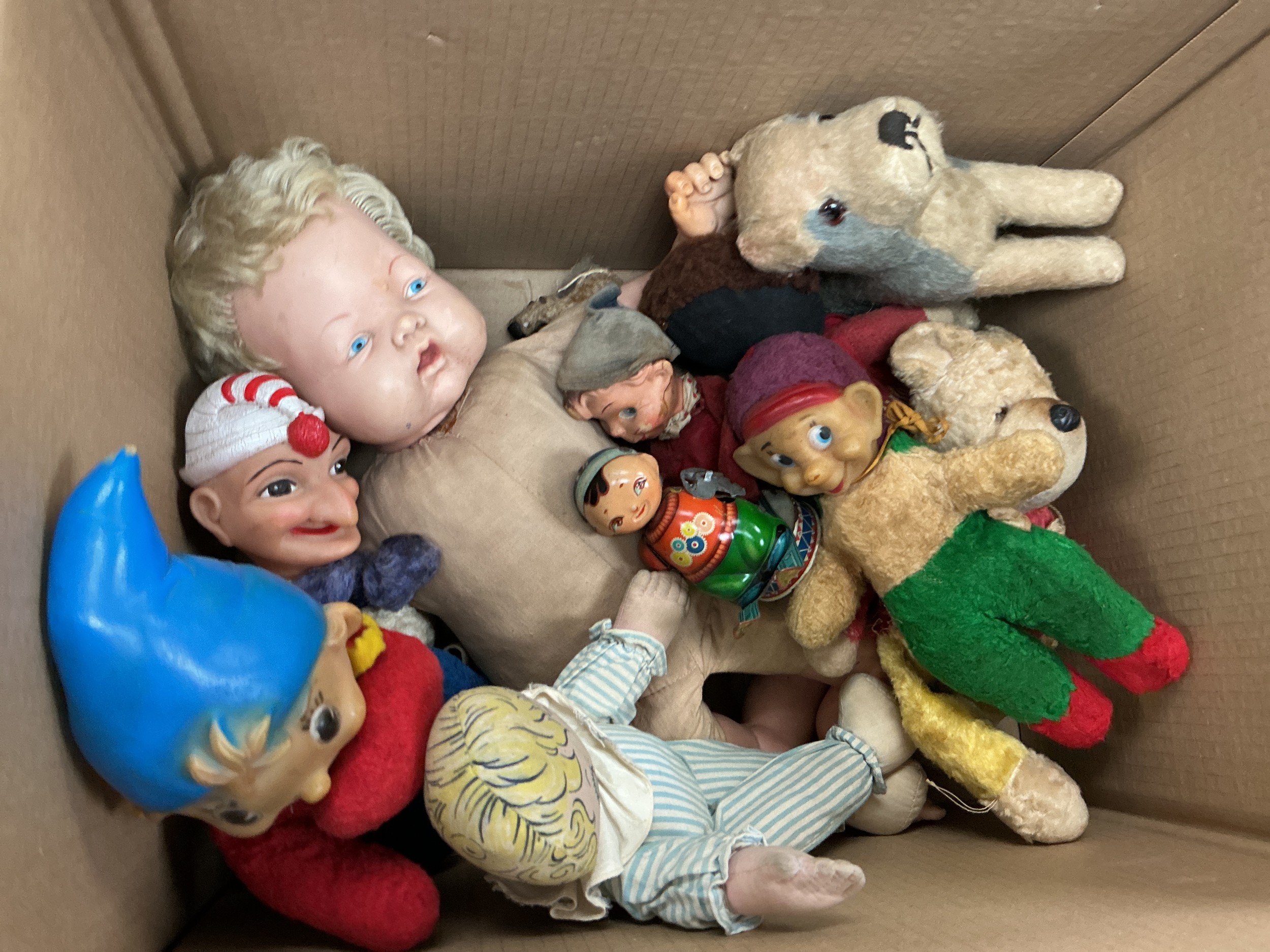 A box of vintage teddy bears, tin plate toys etc.