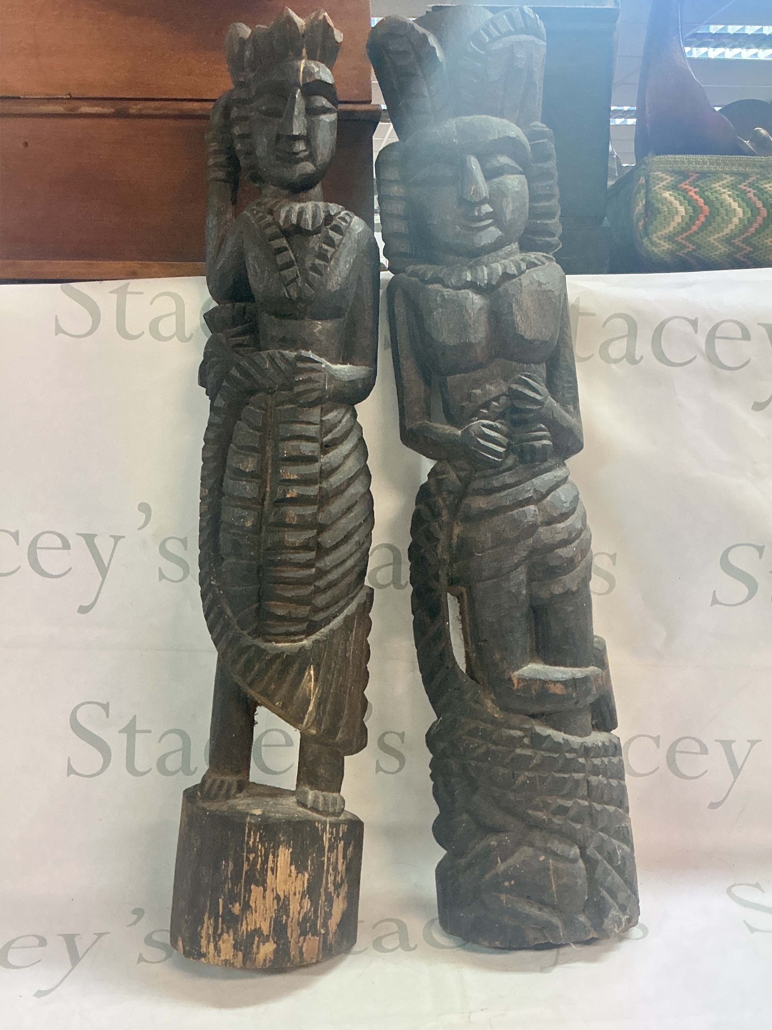 A pair of wooden figure carvings, 67cm tall