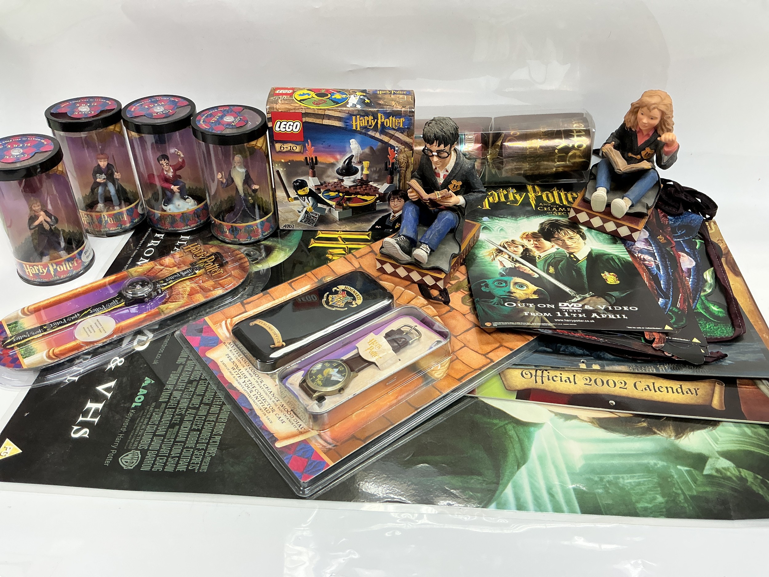A collection of Harry Potter related items comprising bookends, boxed Hero Series figures, Lego set etc.