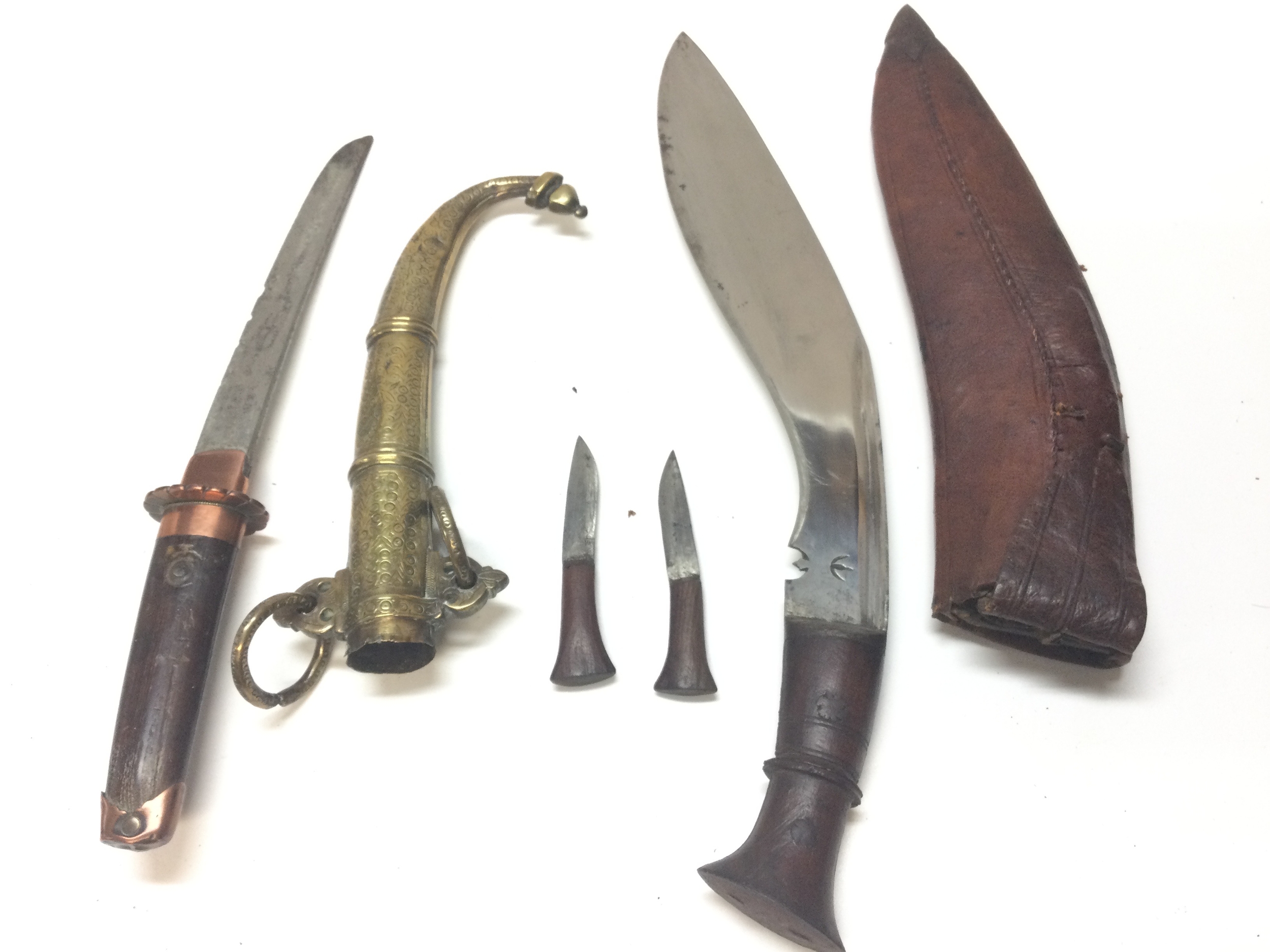 2 distinct knives, a Japanese sword (35cm) with Middle Eastern scabbard, a Nepalese Kukri knife with two other mini knives