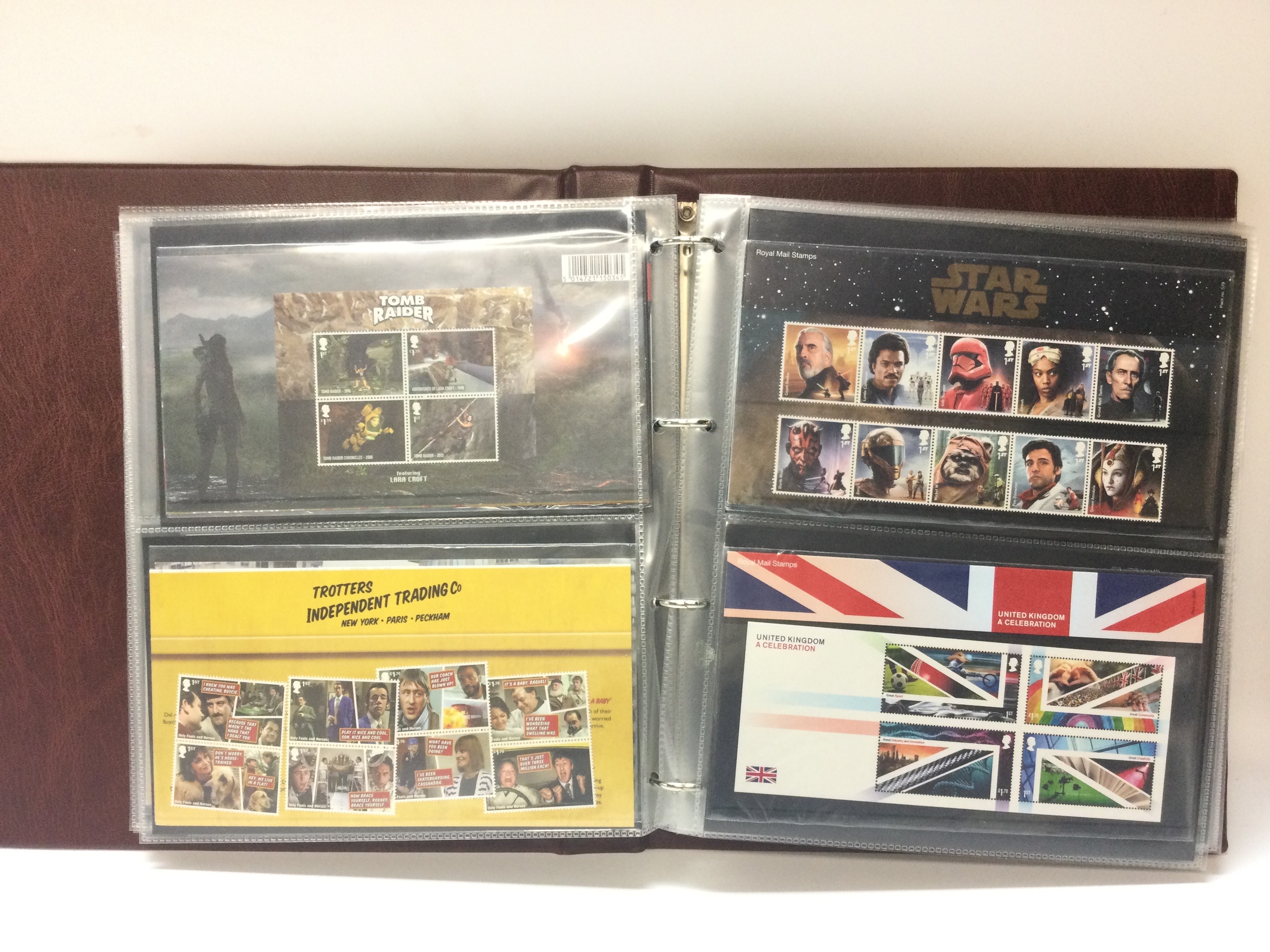 7 Queen Elizabeth II Royal Mail presentation covers filled with first class stamps