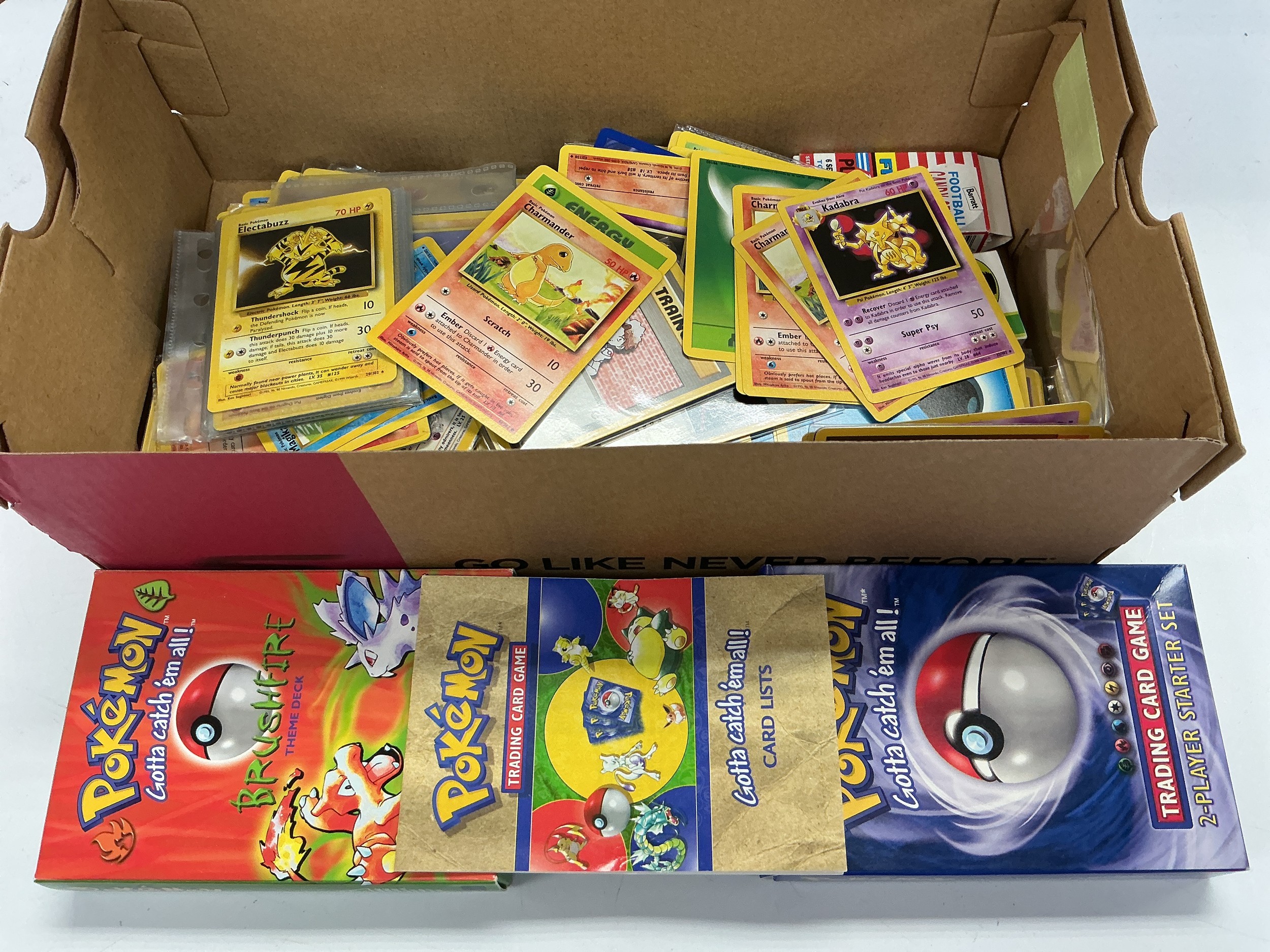 A collection of Pokémon trading cards.