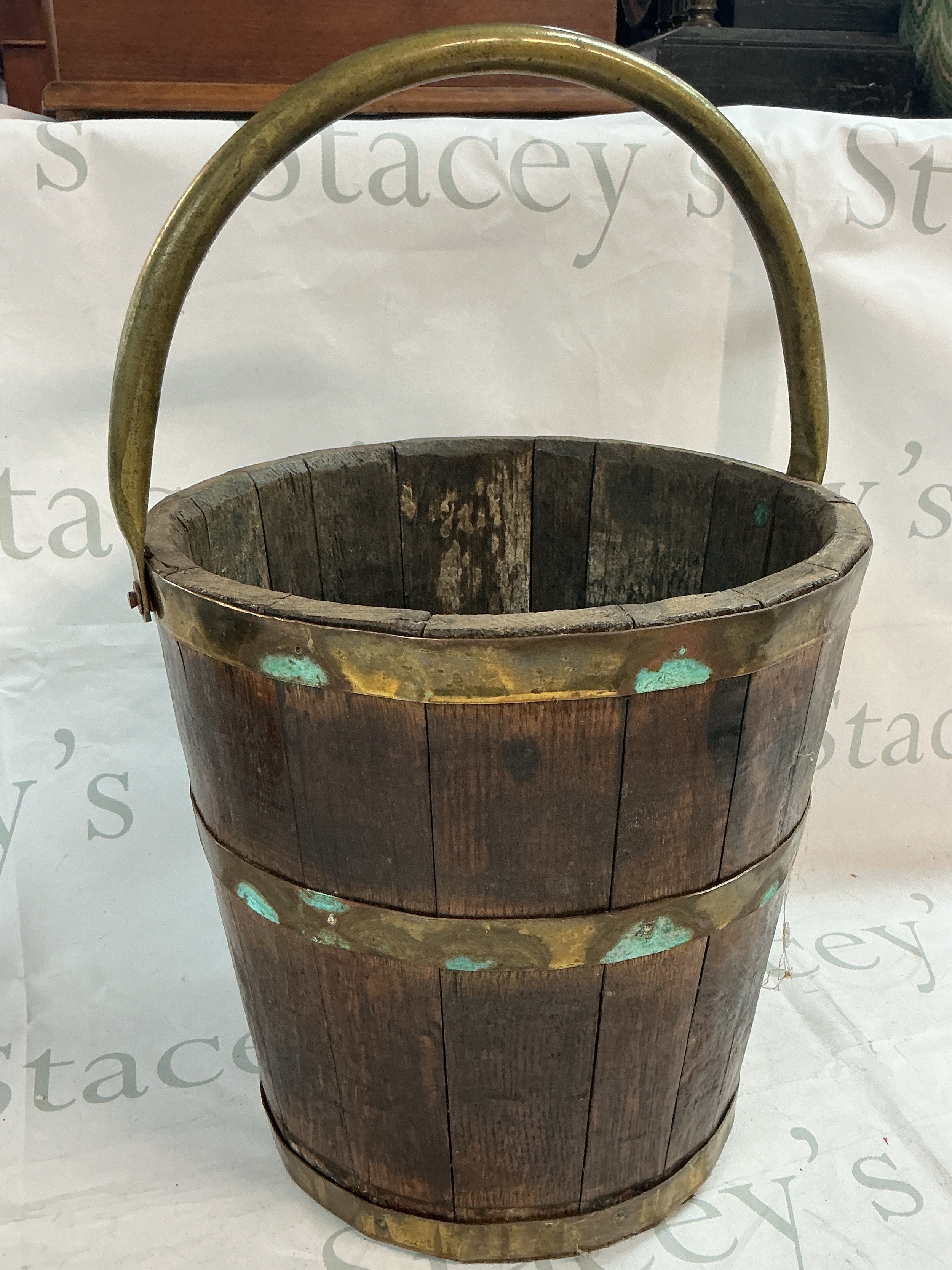 A brass bounded oak bucket, 31cm tall