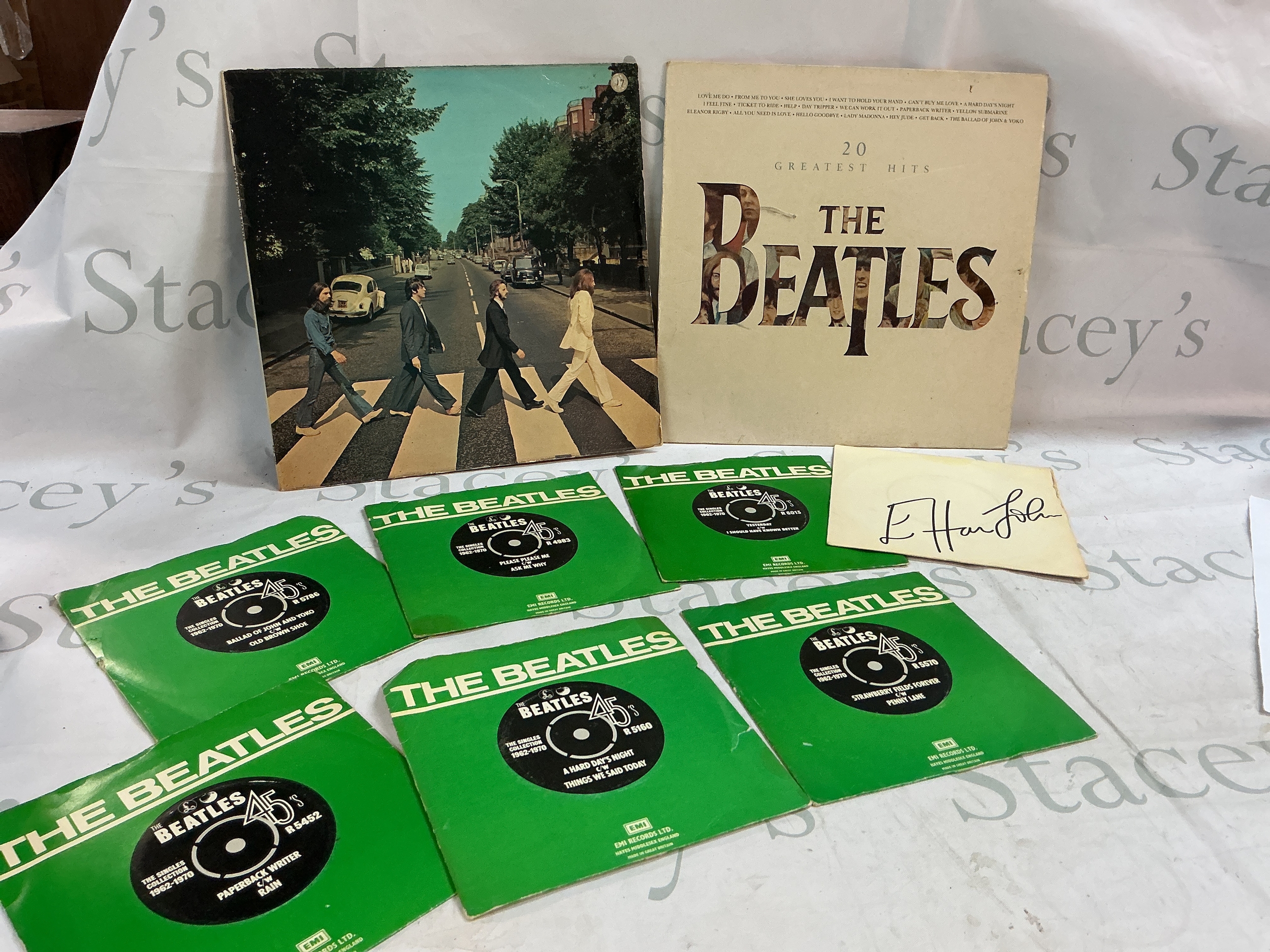 A collection of Beatles vinyl two albums including a French pressing of Abbey road and Elton John Island Girl single