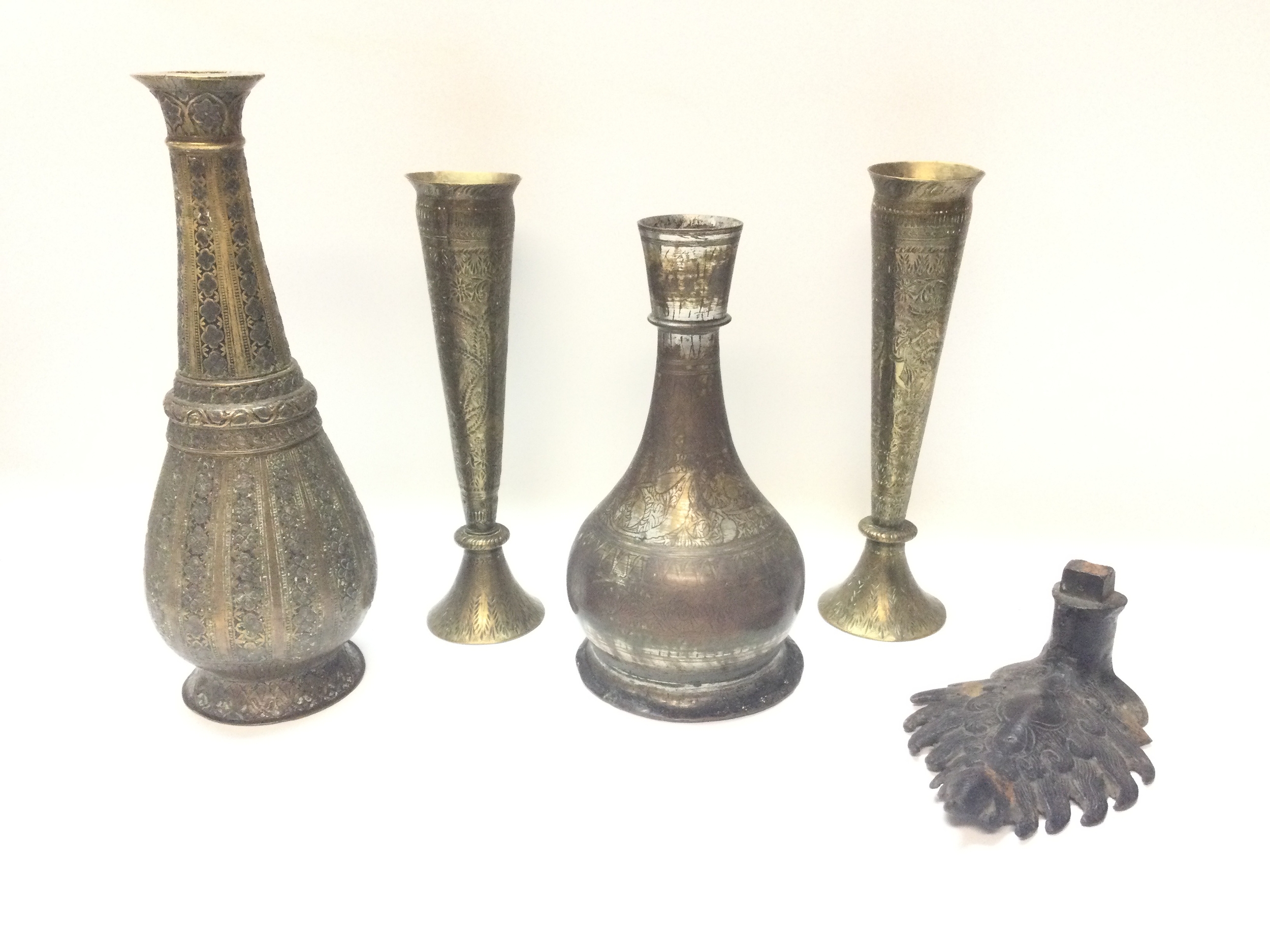 Middle Eastern hand-etched brass vessels and an unusual cast metal decorative mount 