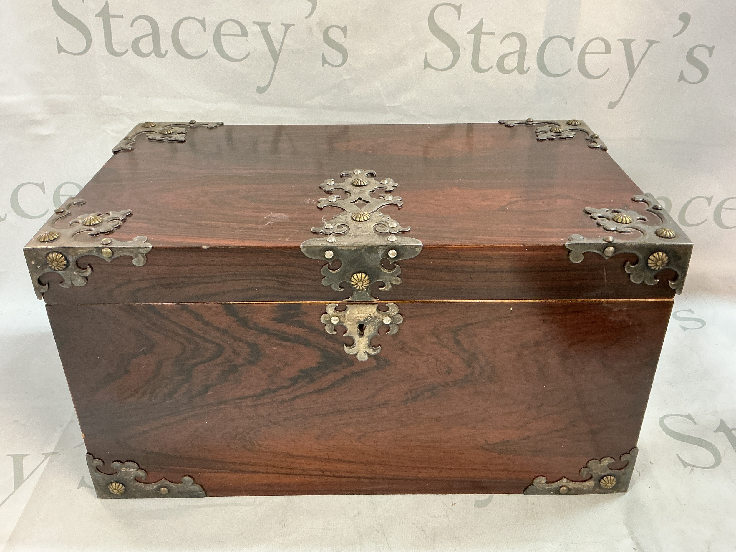 A 19th century wooden jewellery box with metal mounts and a fitted interior. Lid needs restoration. 38.5cm wide, 23cm long, 20cm tall 