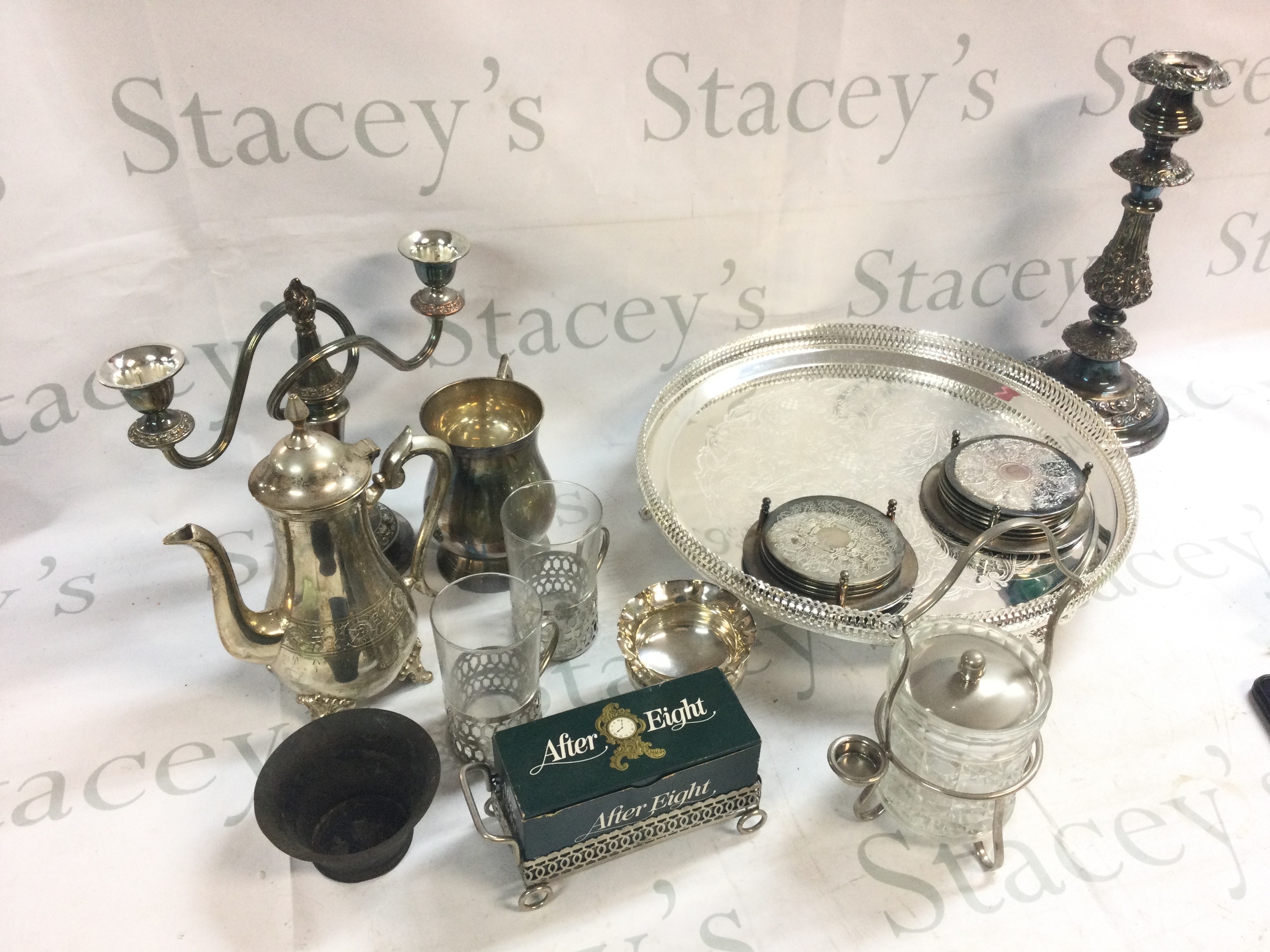 A large collection of silver plated ware including dishes, candlesticks, cups, teapots etc 