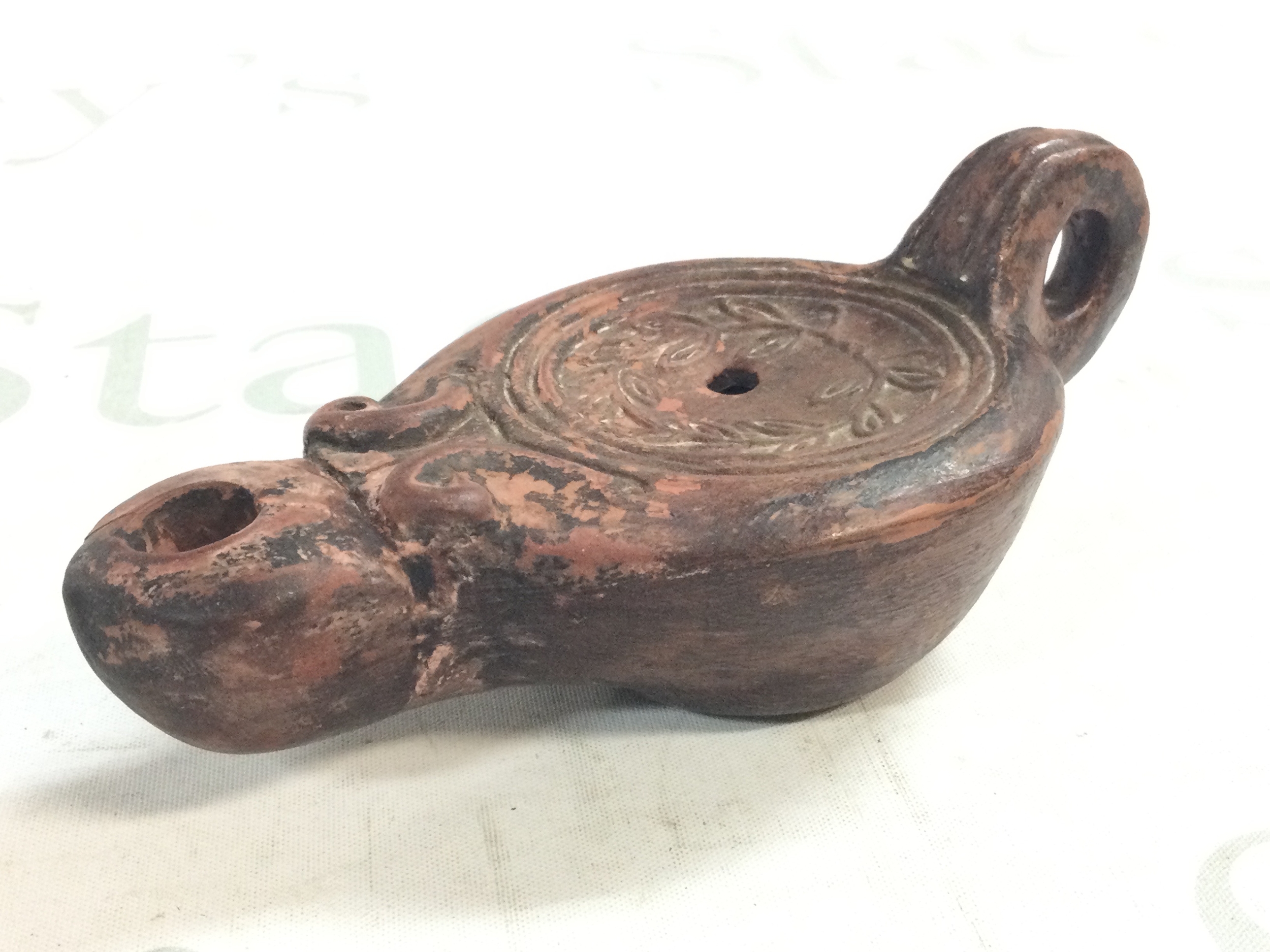 An Ancient Egyptian lamp, 16cm long