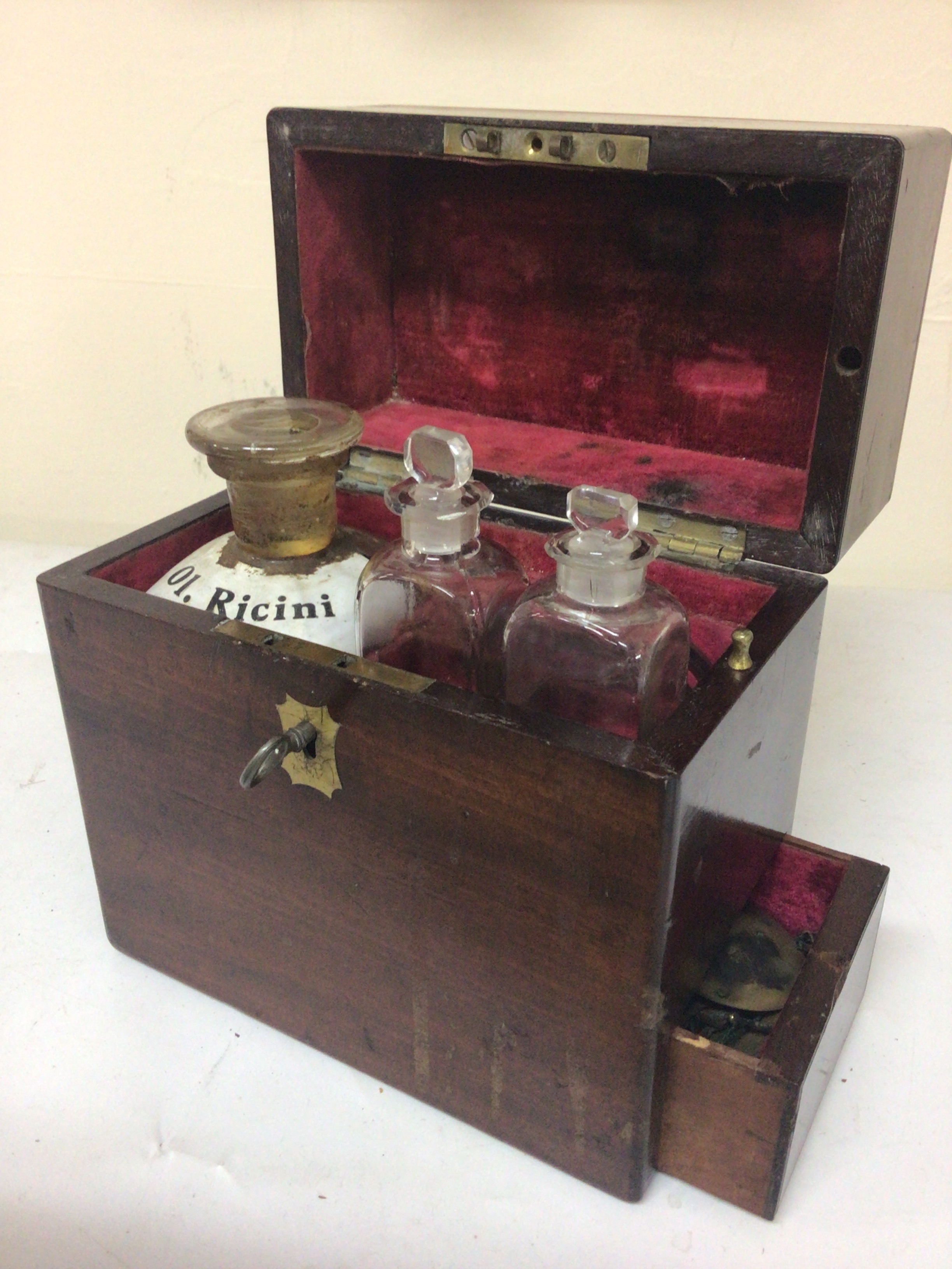  A 19th century mahogany medical Apothecary case with fitted bottles. the fitted case with a side drawer. 