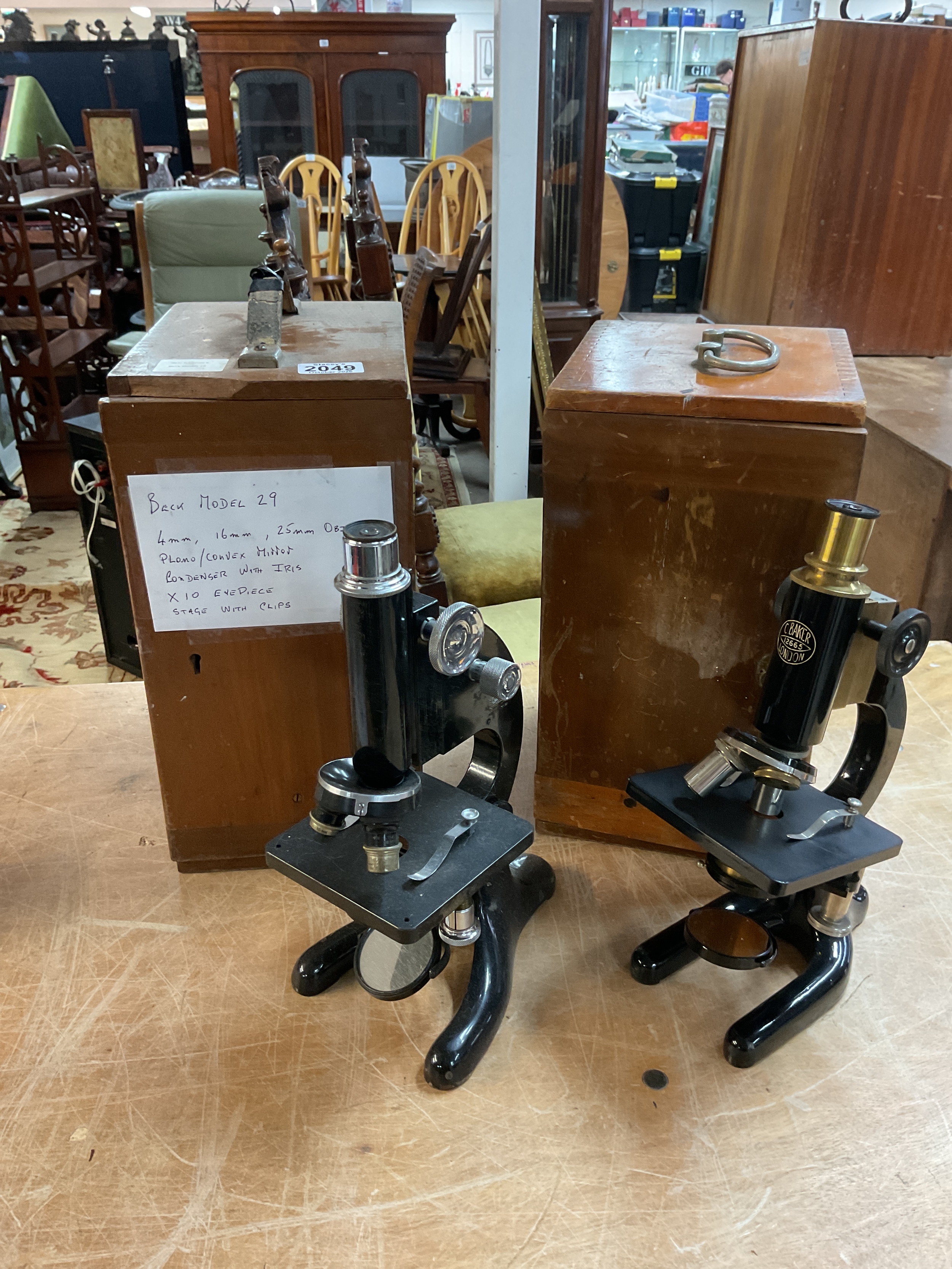 Beck model 29 microscope in case.and a C Baker 12665 in case.