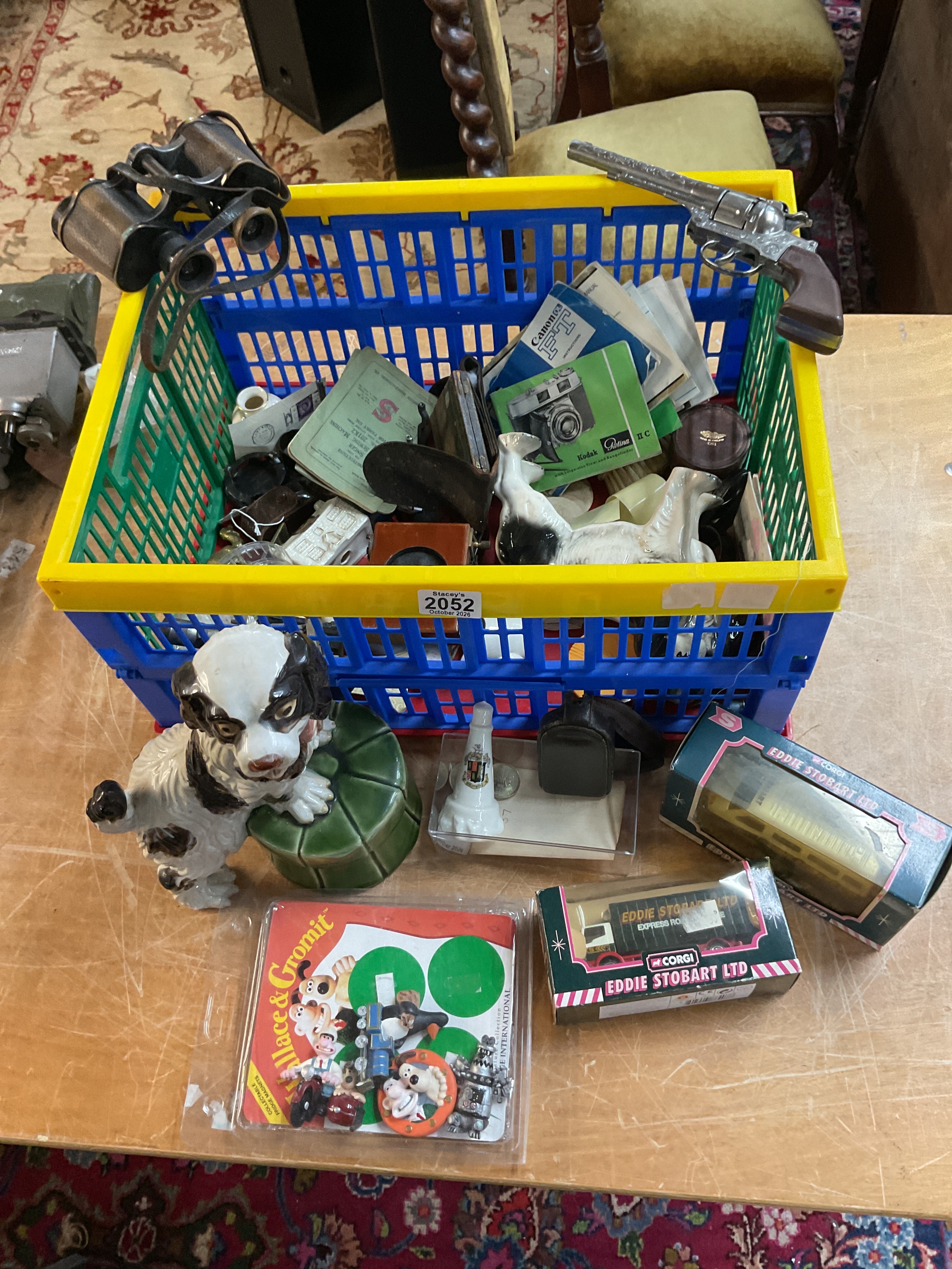 Box of odds to inc ceramics, diecast, crested ware, binoculars, camera equipment etc.
