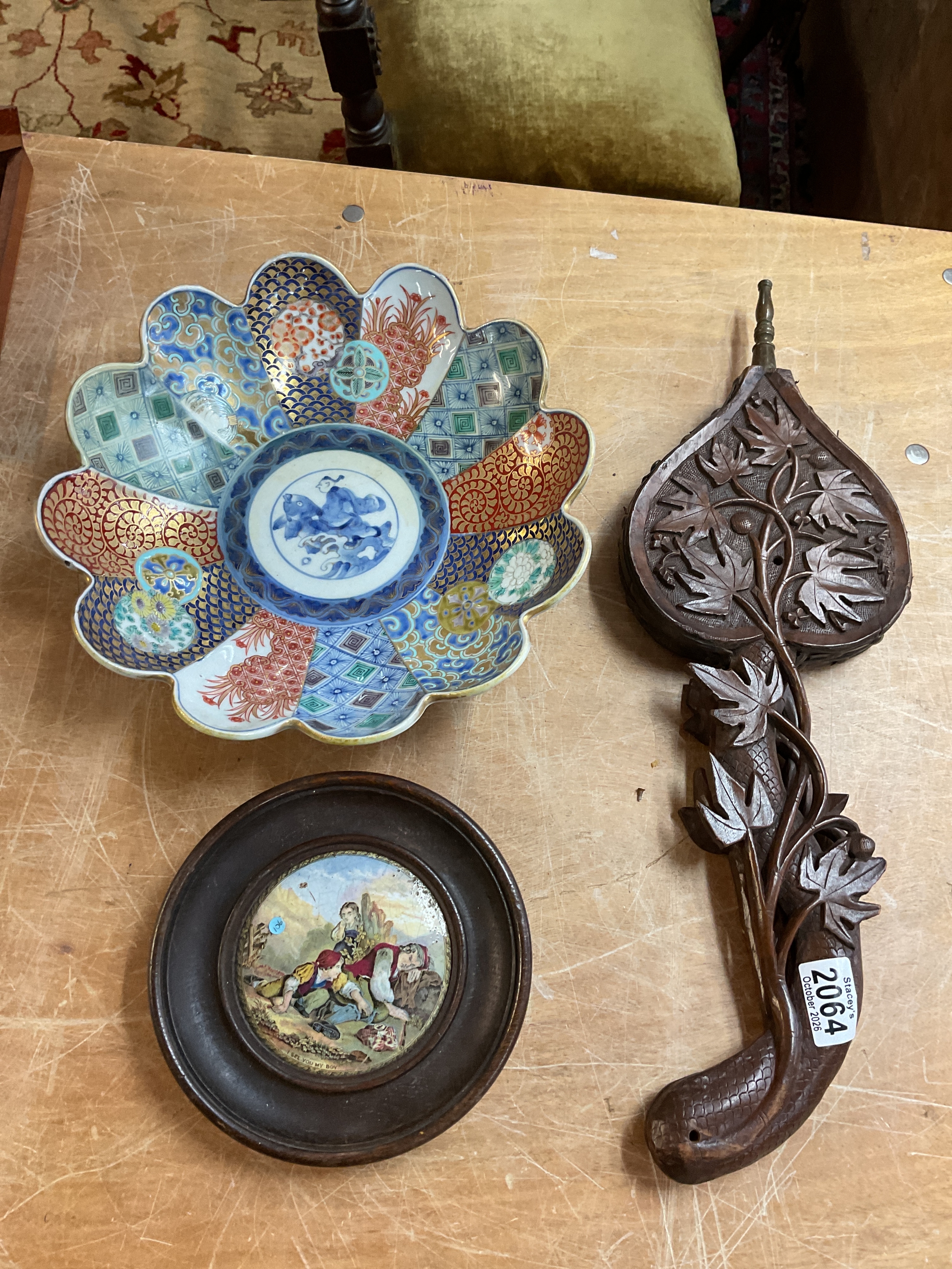 Black Forest carved bellows , oriental restored bowl and pot lid "I see you my boy".