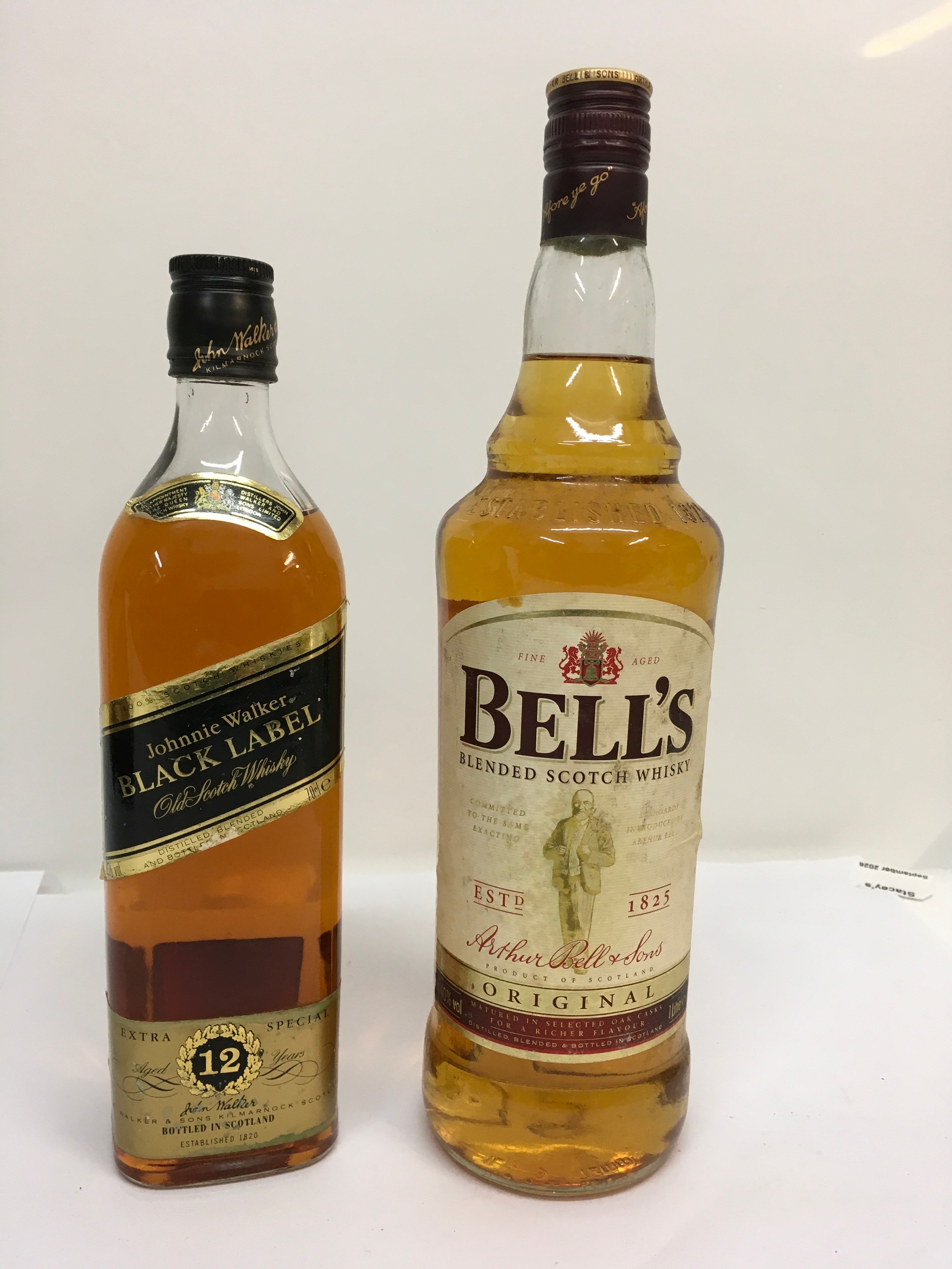 Two bottles of scotch whisky comprising Johnnie Walker Black Label and Bell's