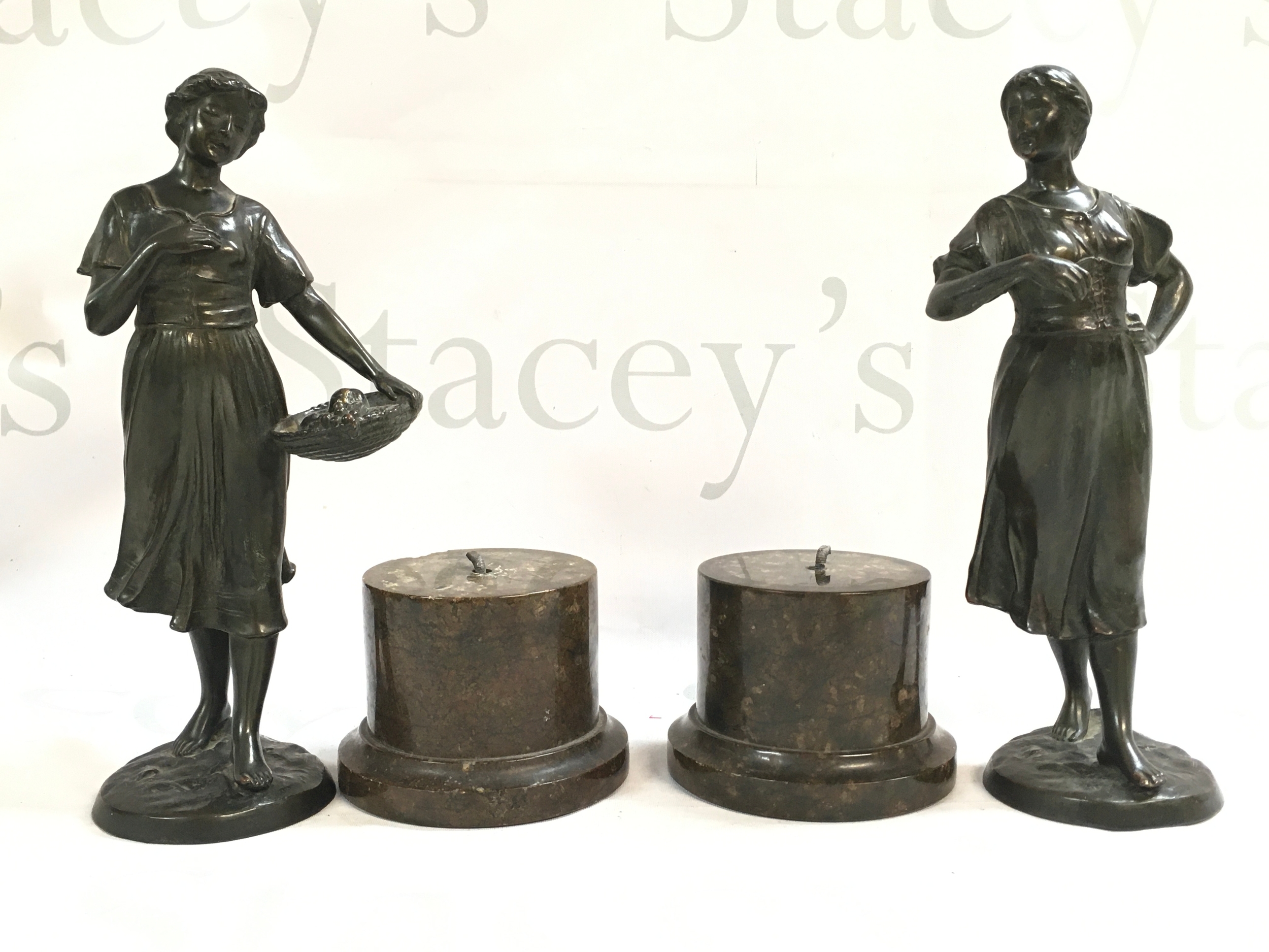 A pair of Edwardian circa 1910-20 bronze figures of two girls with marble bases . Figures 24cm tall