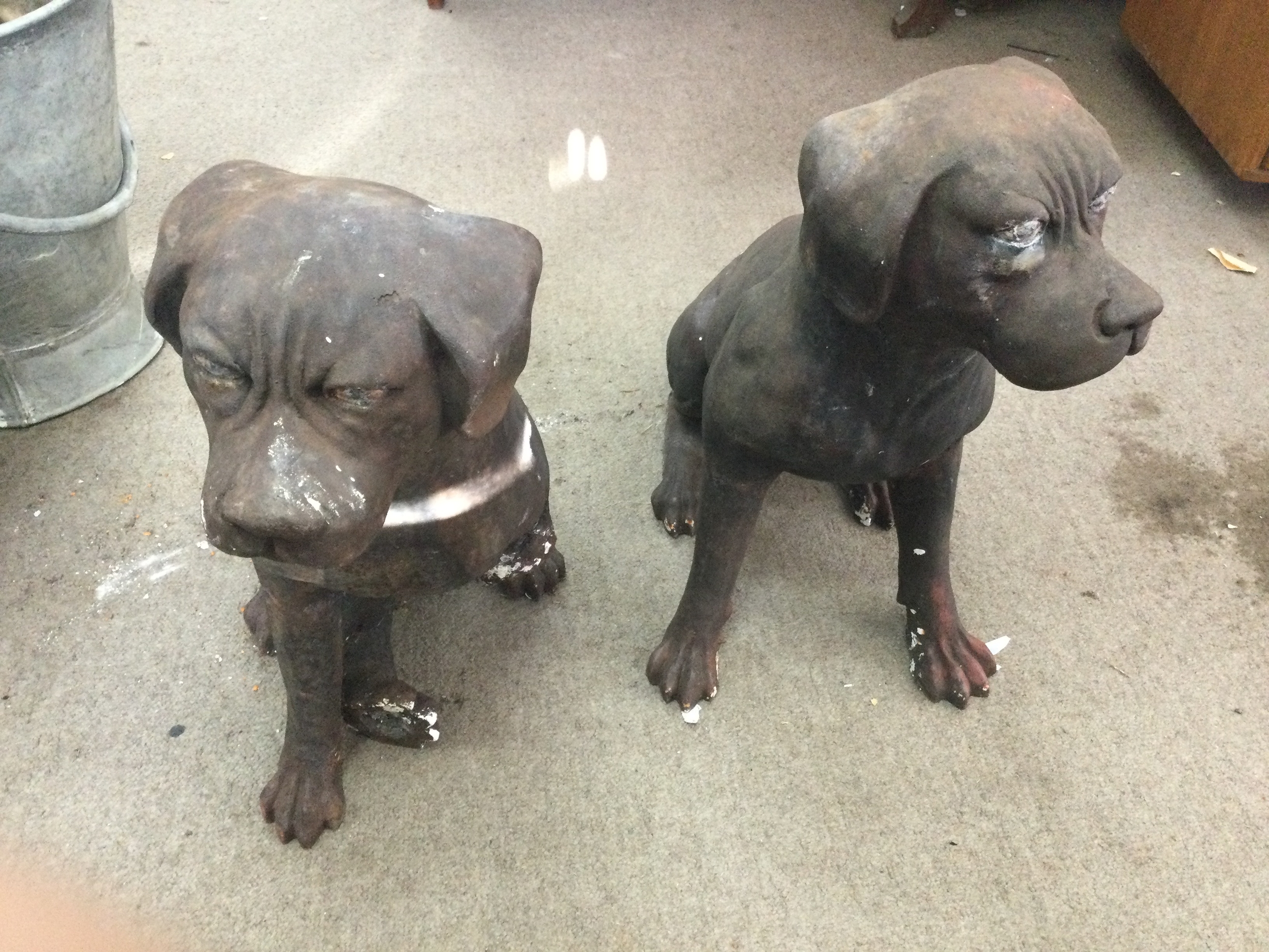 Pair of cast iron dog ornaments, one with a broken leg 