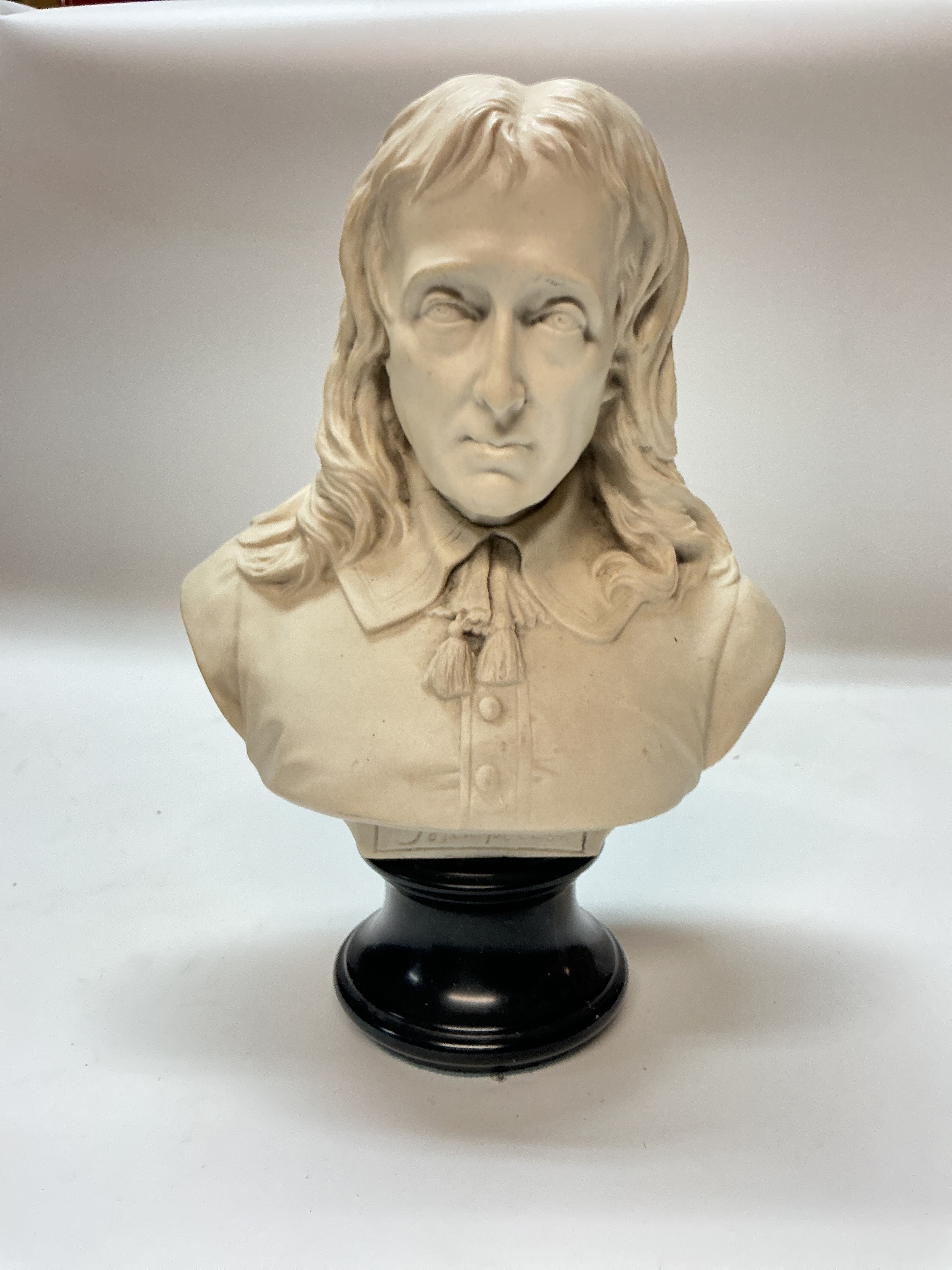 A resin bust of the English poet John Milton, 32cm tall