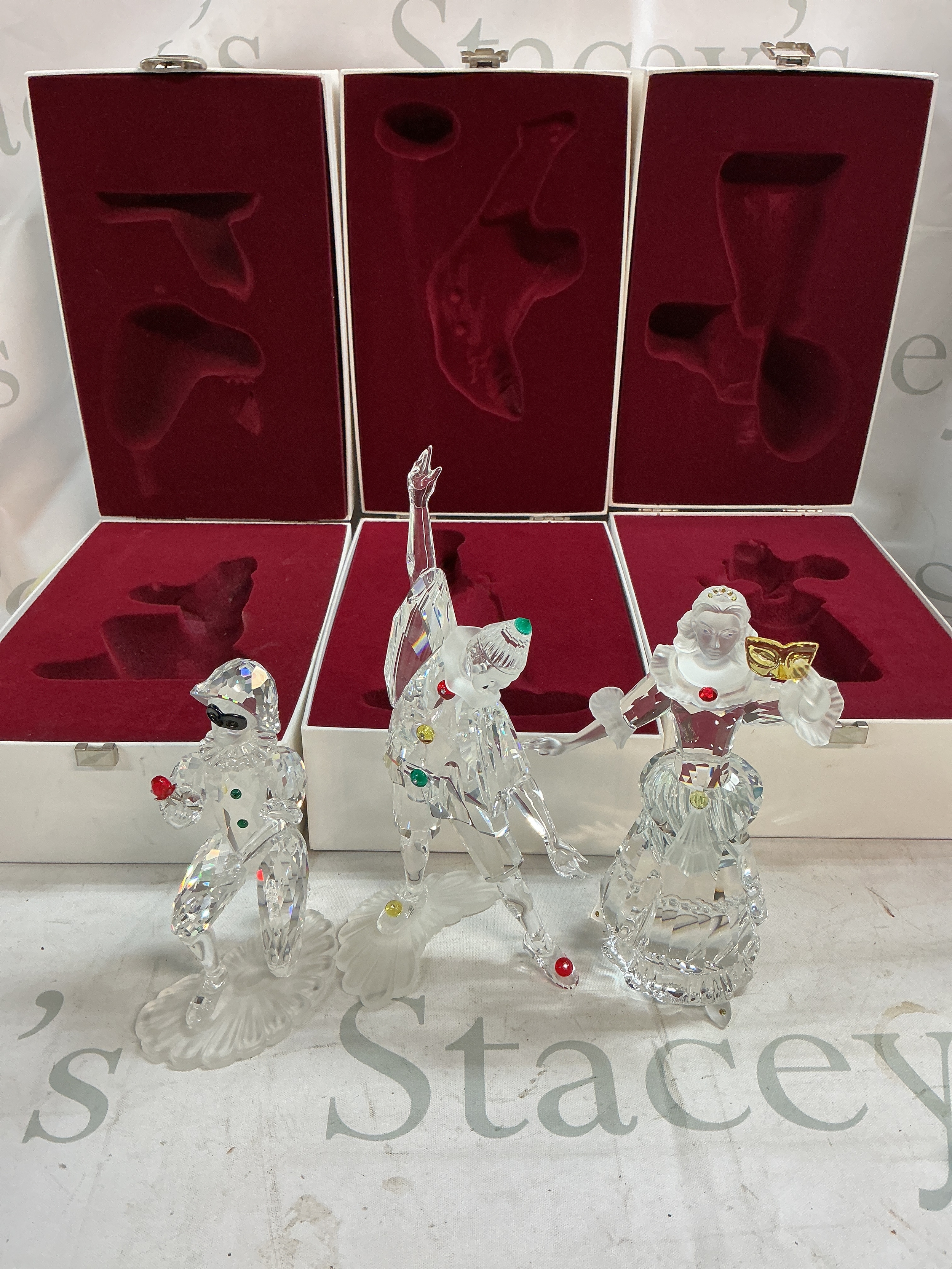 Three boxed 'Masquerade' Swarovski figures 