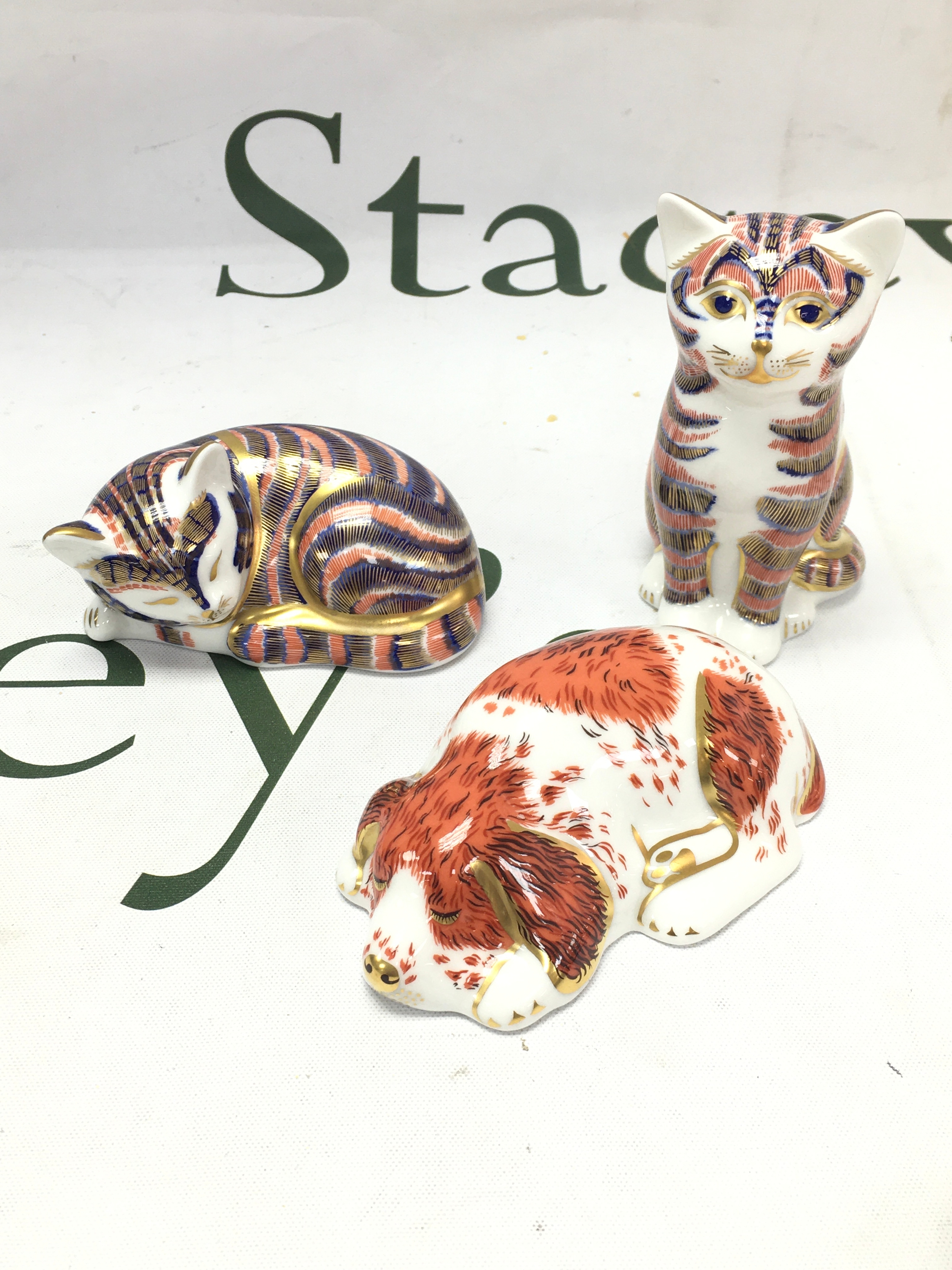 Three Royal Crown Derby gold button figures , two cats and a puppy 
