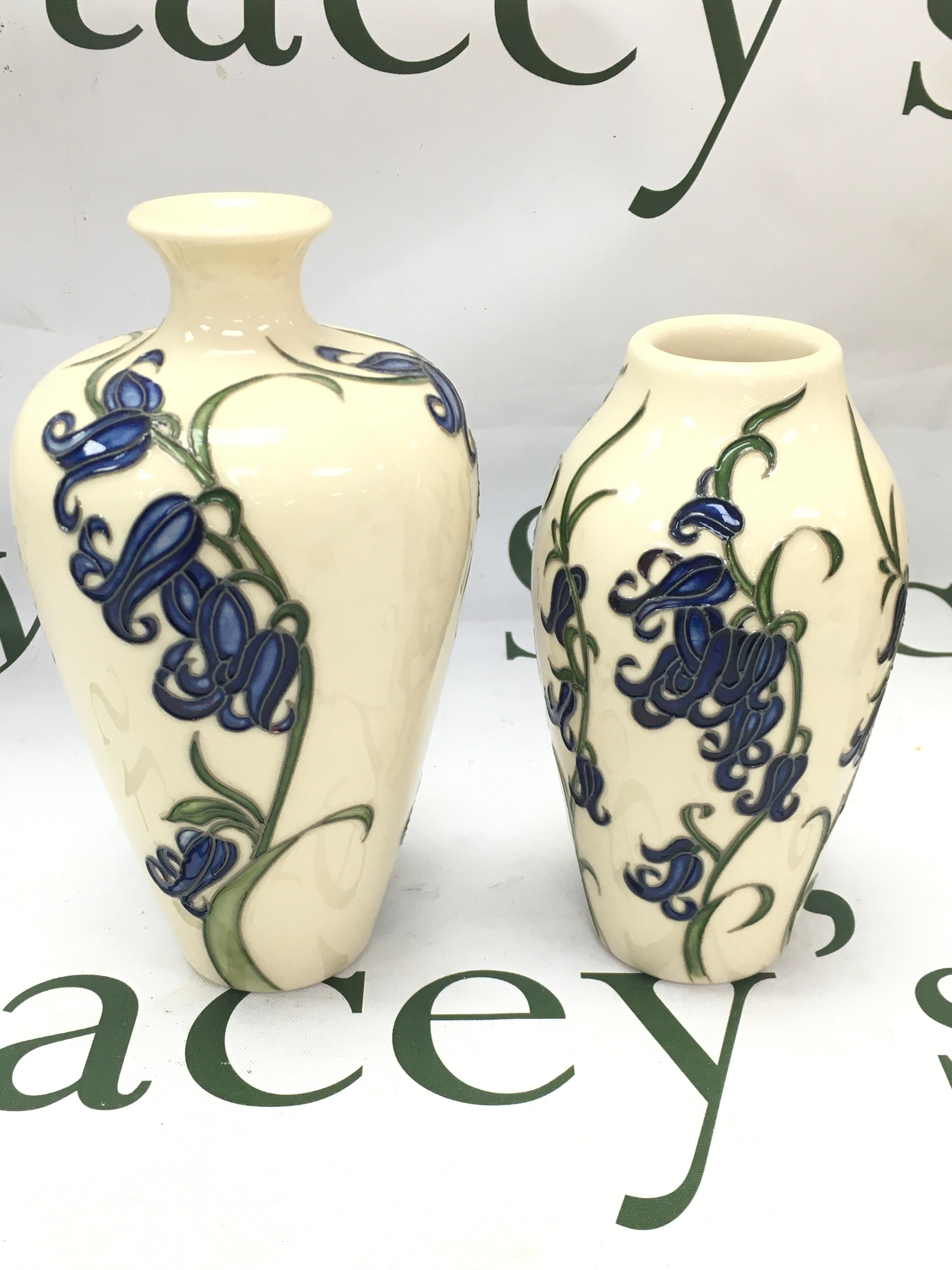 Two Moorcroft bluebell vases, 14 and 16cm tall. No obvious damage or restoration 