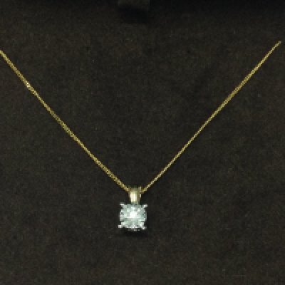 A 9ct gold chain with diamond solitaire pendant.